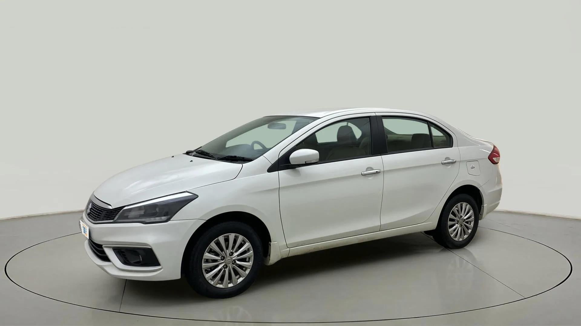 Front three-quarter view of a Pearl Arctic White Maruti Suzuki Ciaz
