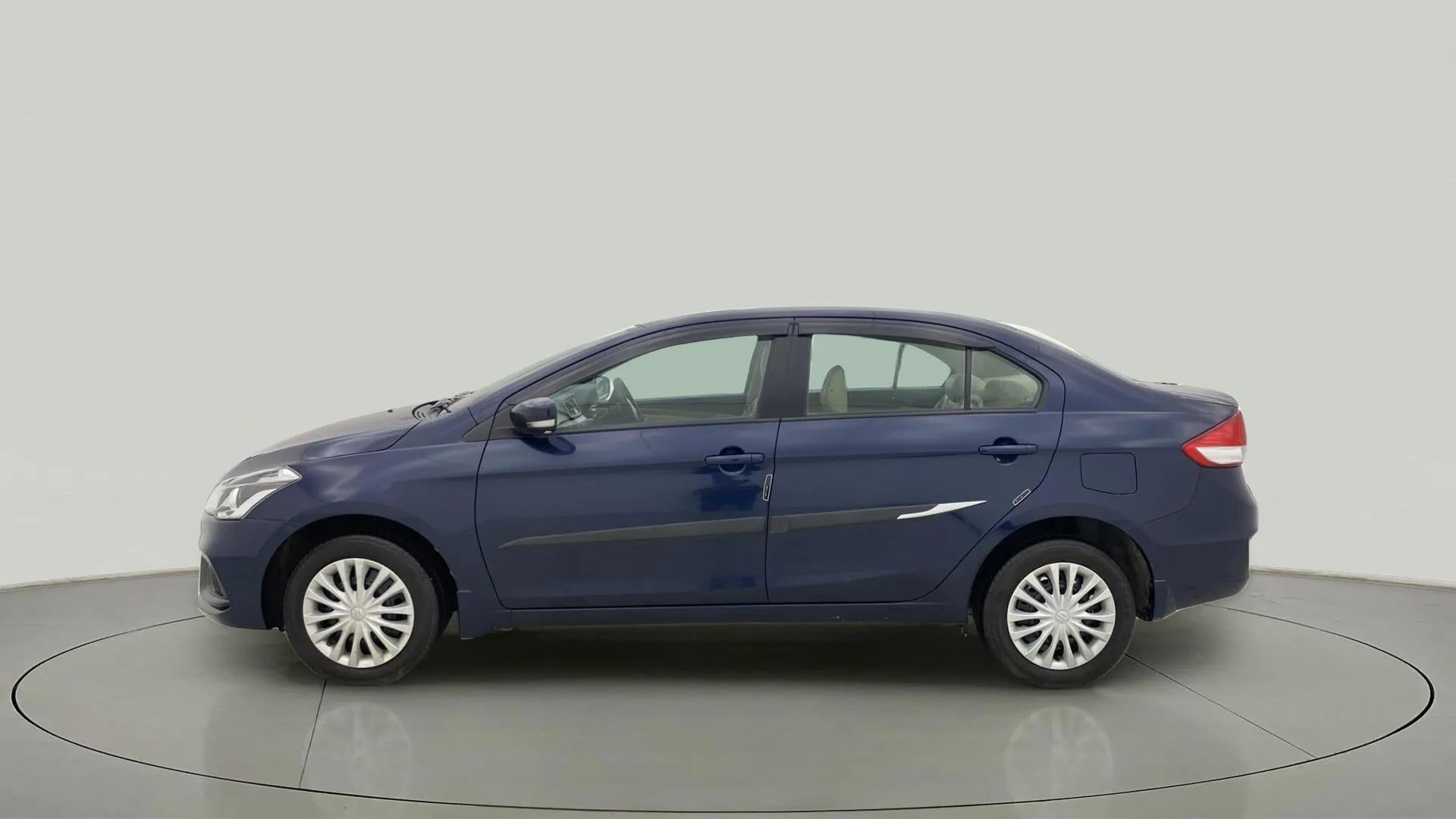 Side view of a Nexa Blue Maruti Suzuki Ciaz