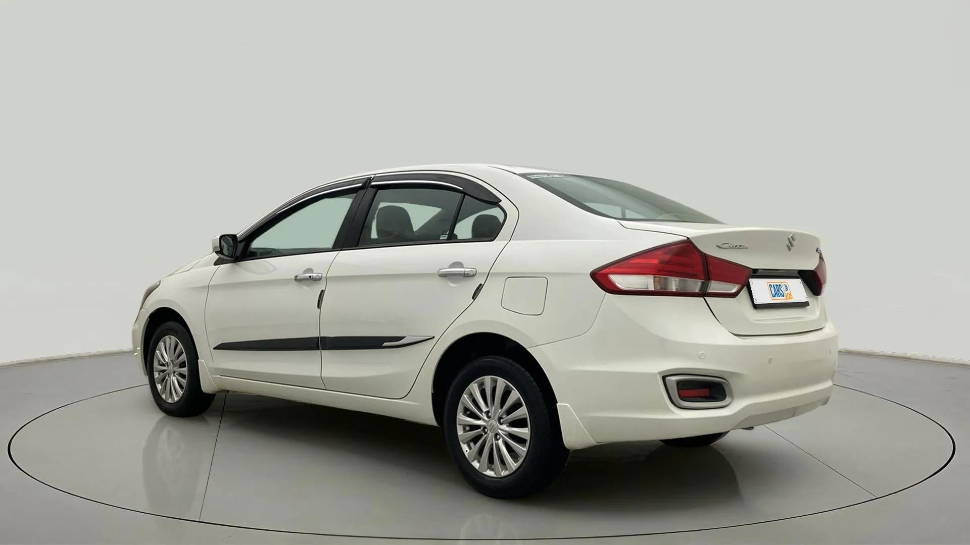 Rear three-quarter view of a Pearl Arctic White Maruti Suzuki Ciaz