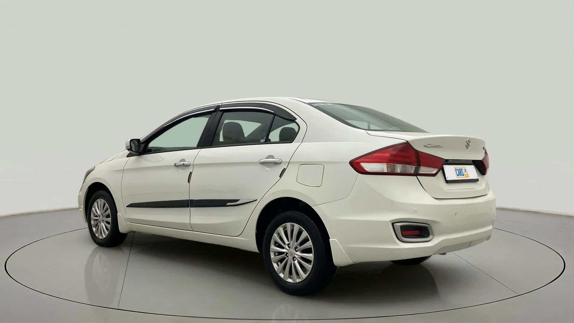 Rear three-quarter view of a Pearl Arctic White Maruti Suzuki Ciaz