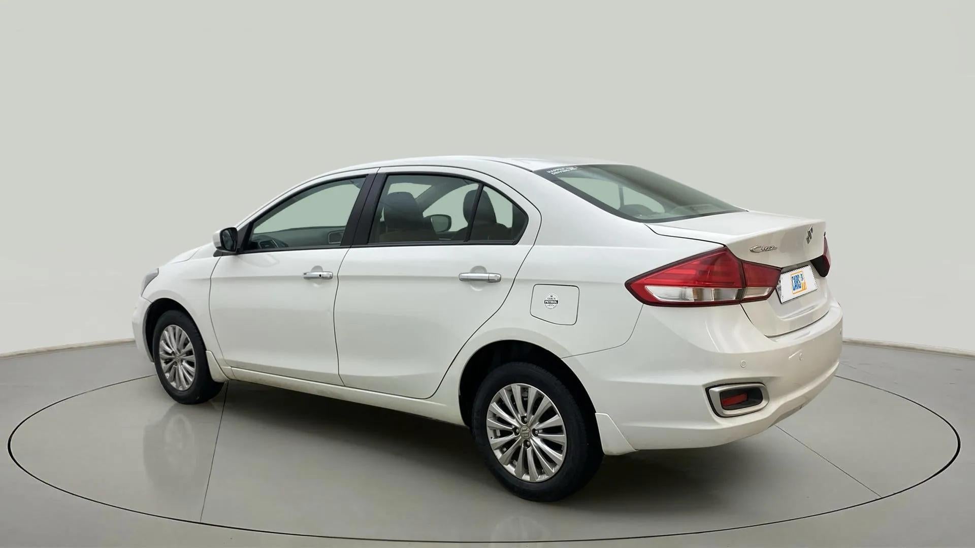 Rear three-quarter view of a Pearl Arctic White Maruti Suzuki Ciaz