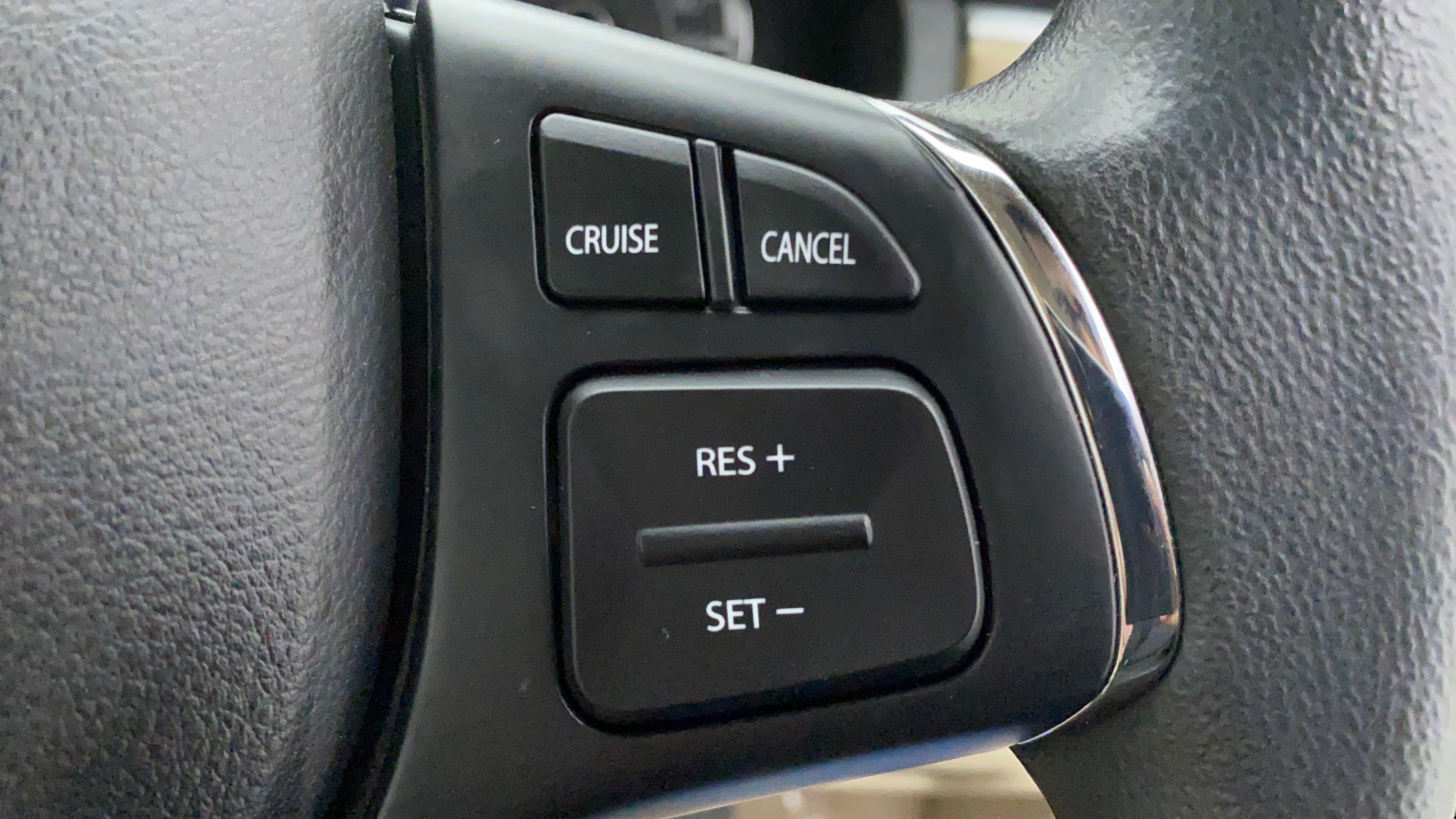 Steering wheel cruise control buttons of a Maruti Suzuki Ciaz