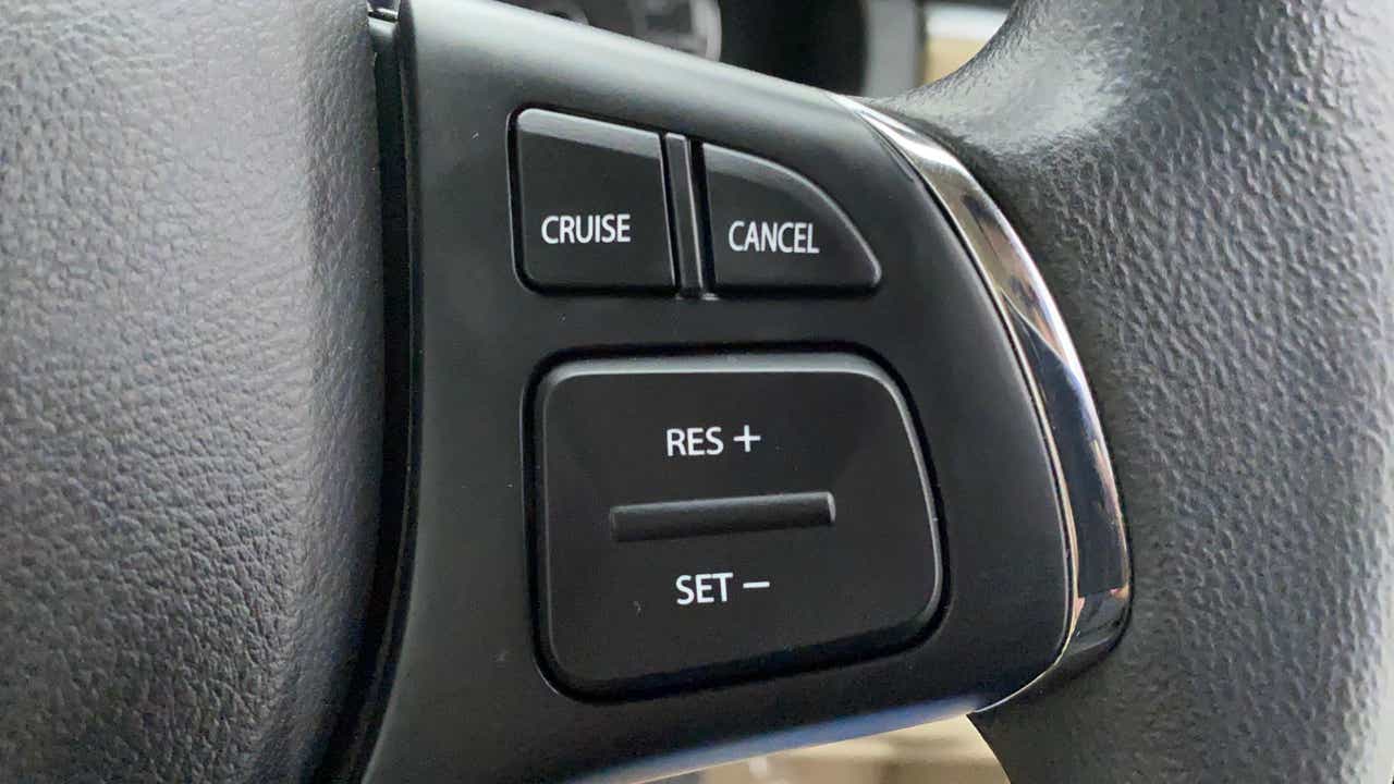 Steering wheel cruise control buttons of a Maruti Suzuki Ciaz