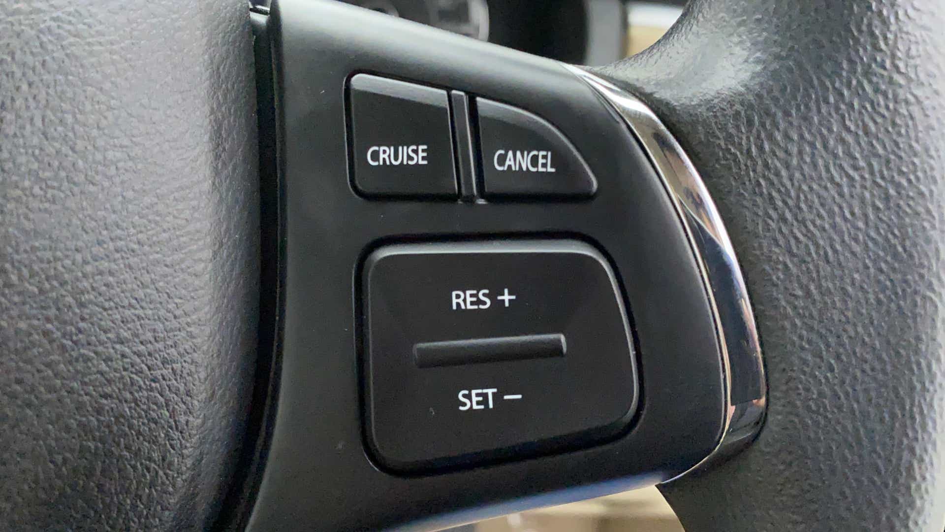 Steering wheel cruise control buttons of a Maruti Suzuki Ciaz