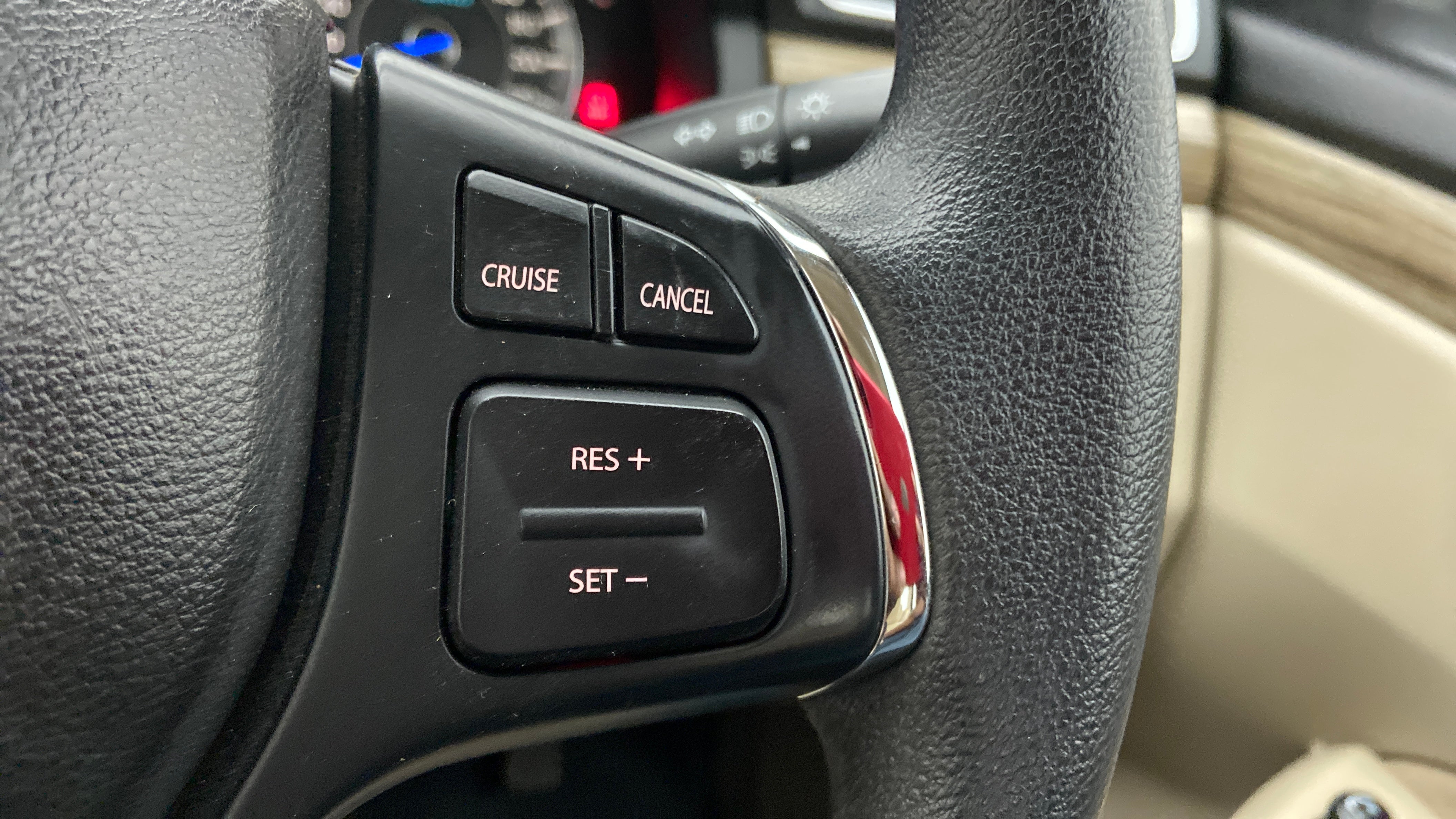 Close-up of steering wheel cruise control buttons of a Maruti Suzuki Ciaz