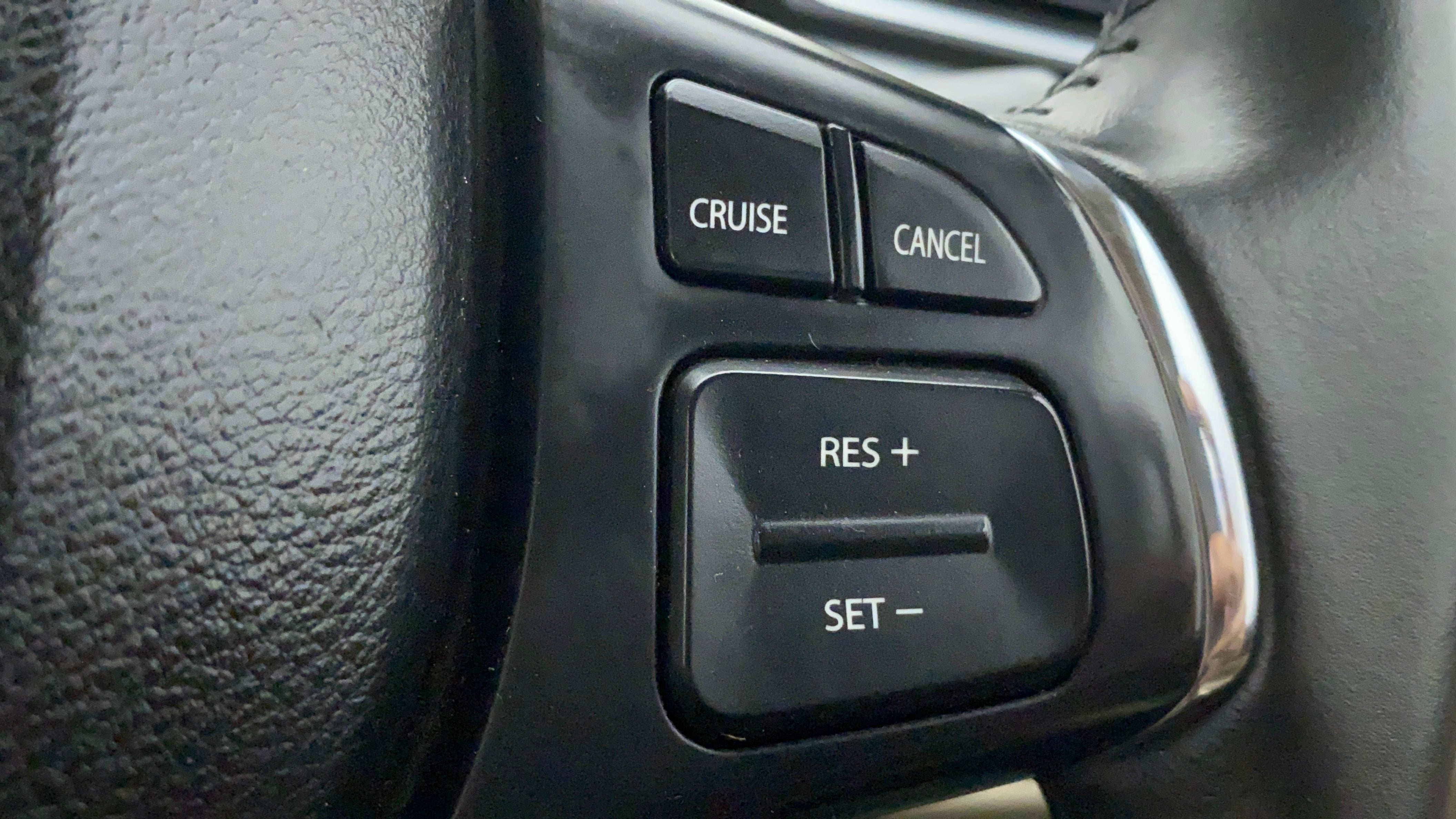 Steering wheel cruise control buttons of a Maruti Suzuki Ciaz