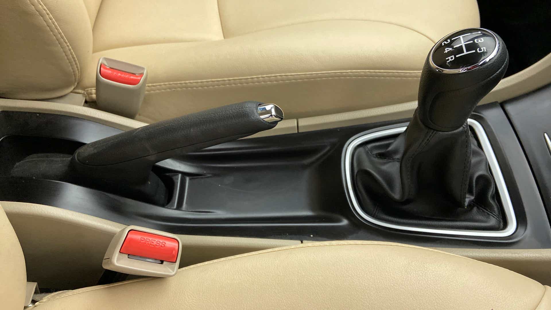 Center console with gear lever and handbrake of a Maruti Suzuki Ciaz