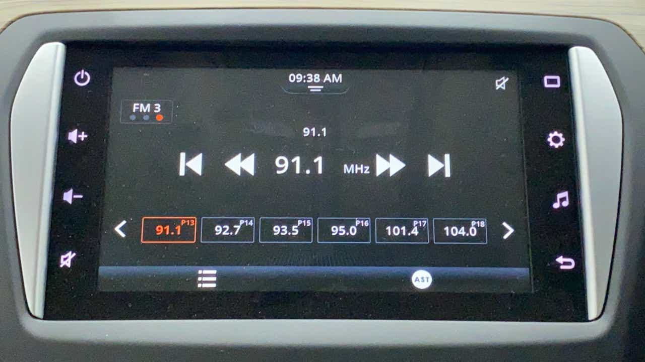 Car infotainment system showing the dashboard radio screen of a Maruti Suzuki Ciaz.