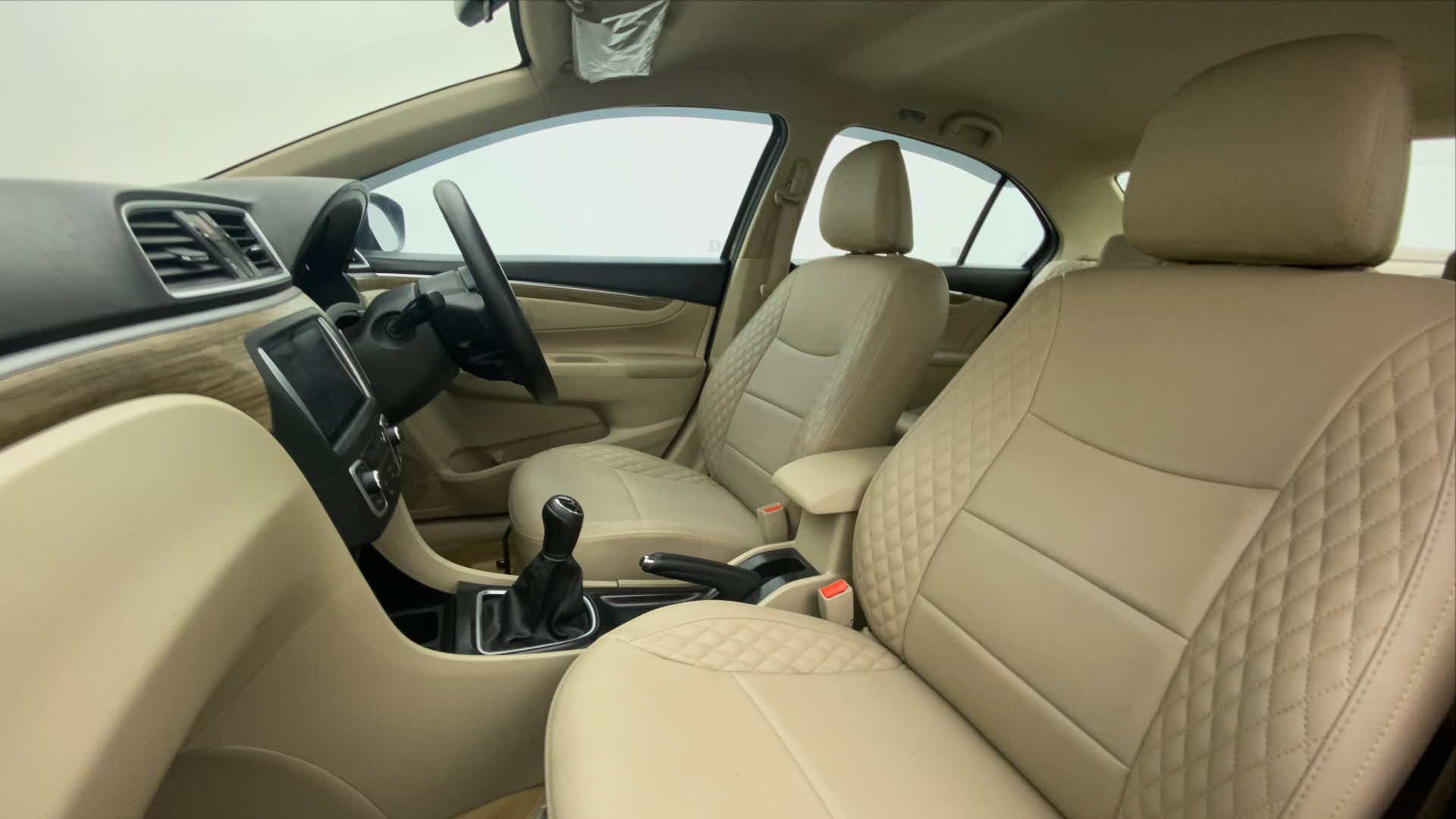 Front interior seats and dashboard of a Maruti Suzuki Ciaz