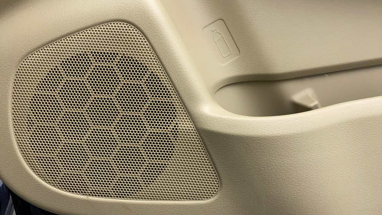 Close-up of the door speaker and bottle holder in a Maruti Suzuki Ciaz