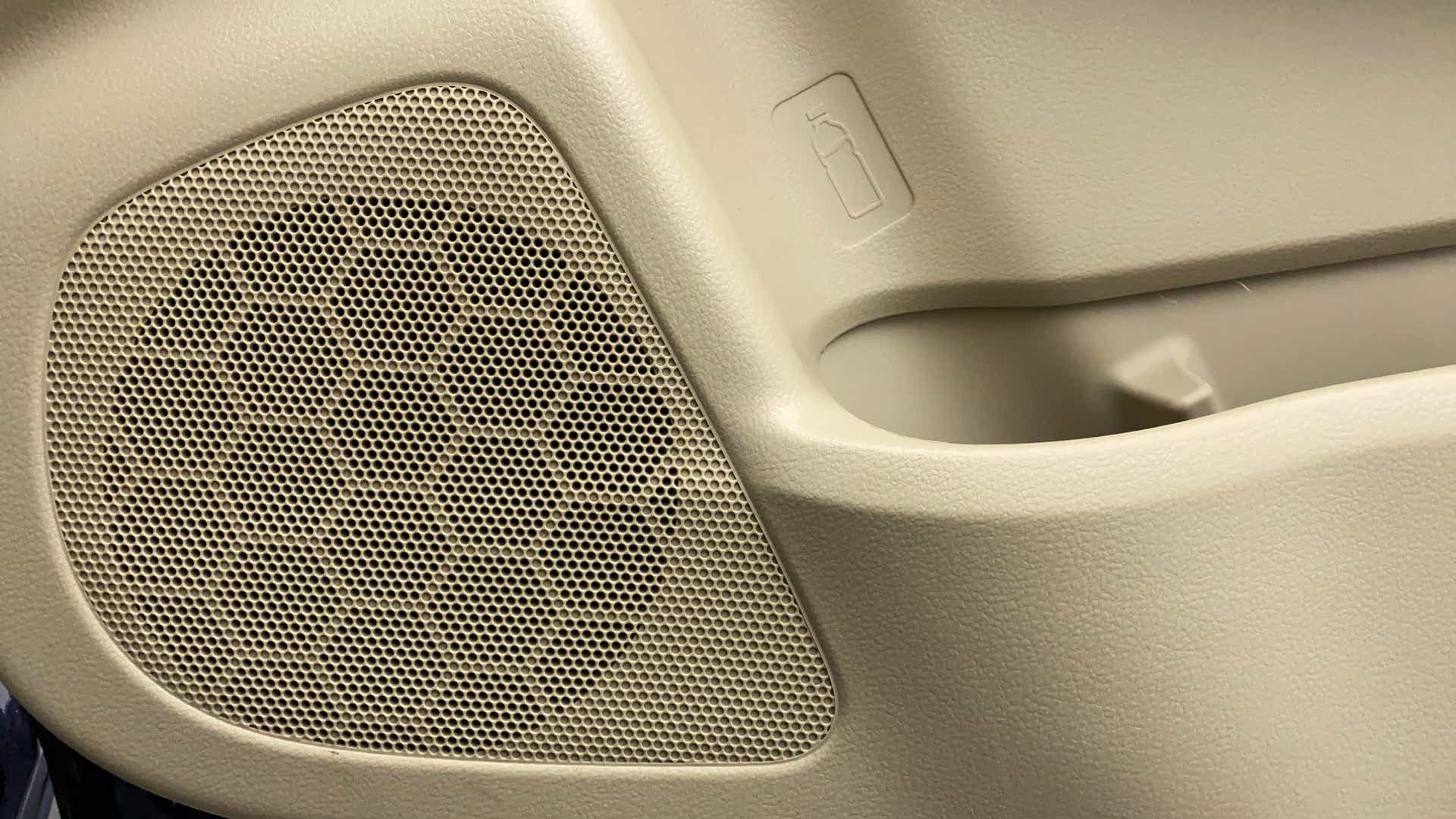 Close-up of the door speaker and bottle holder in a Maruti Suzuki Ciaz