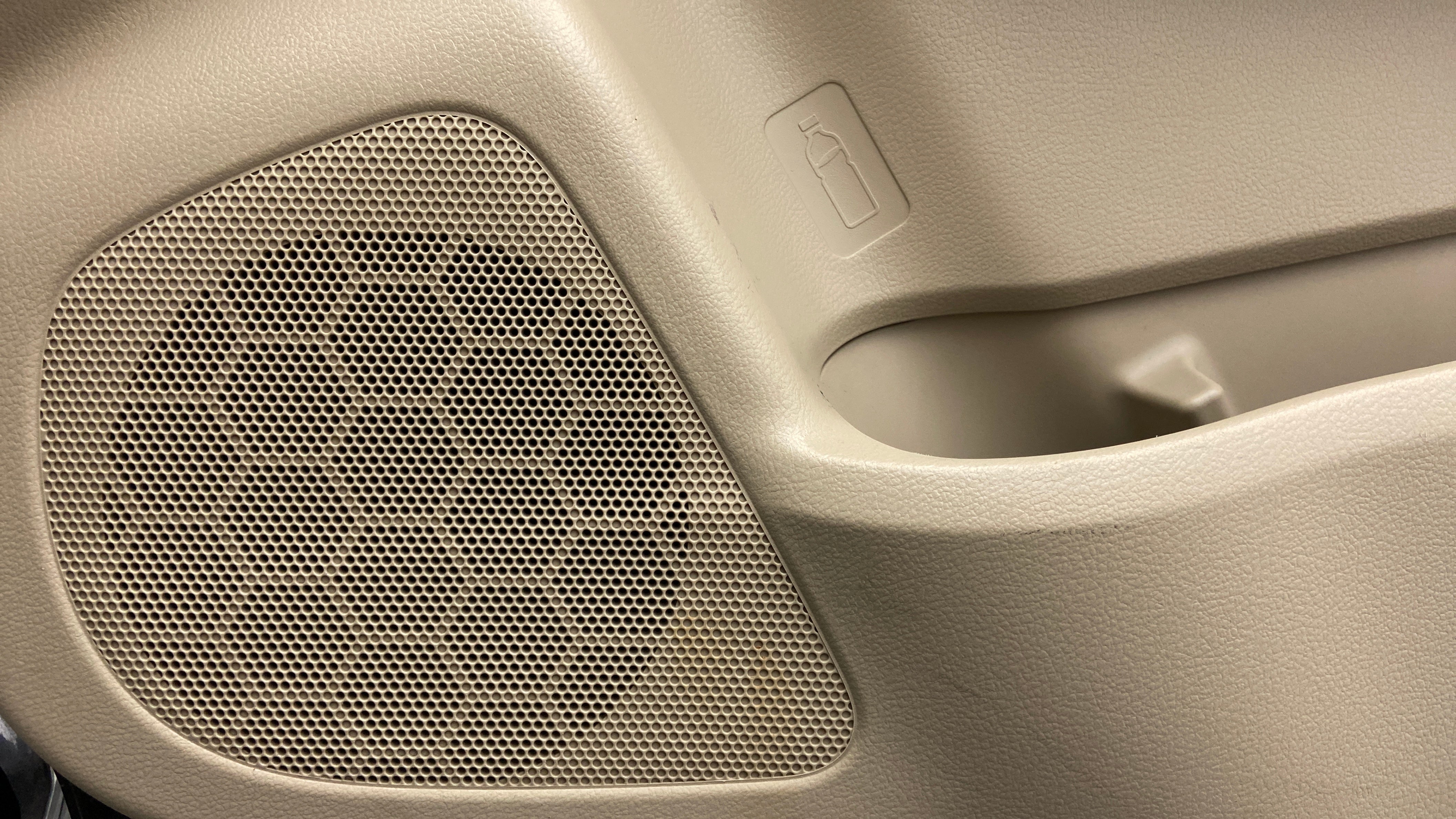 Door speaker and bottle holder area of a Maruti Suzuki Ciaz