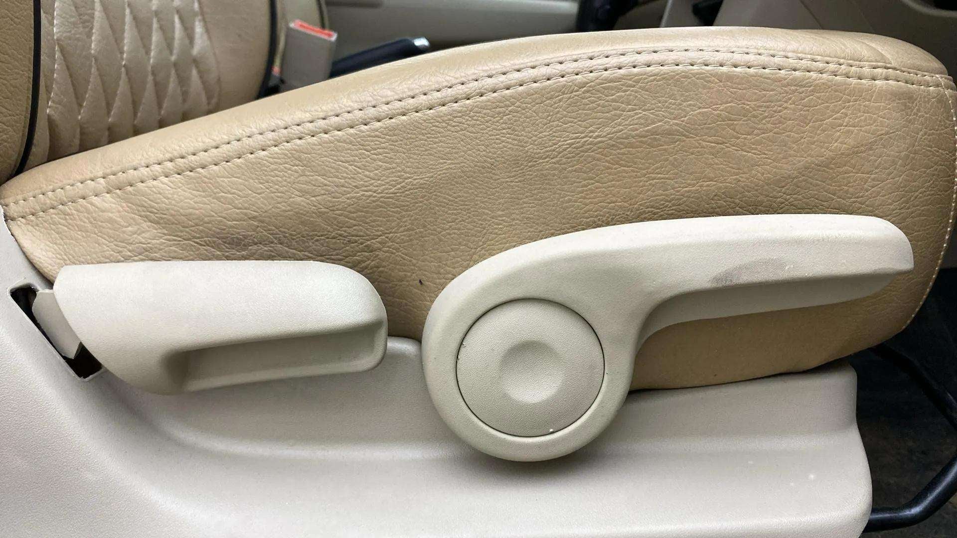 Close-up of the front seat-side adjustment lever of a Maruti Suzuki Ciaz