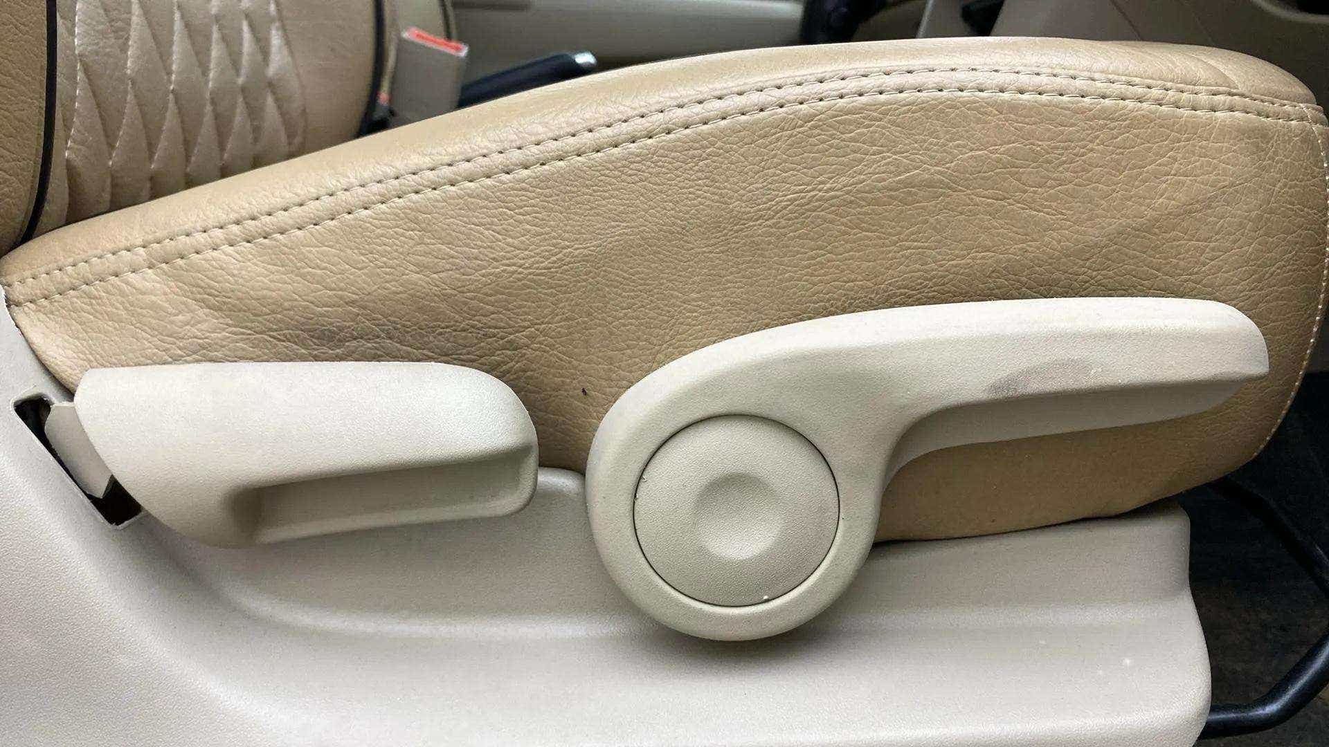 Close-up of the front seat-side adjustment lever of a Maruti Suzuki Ciaz