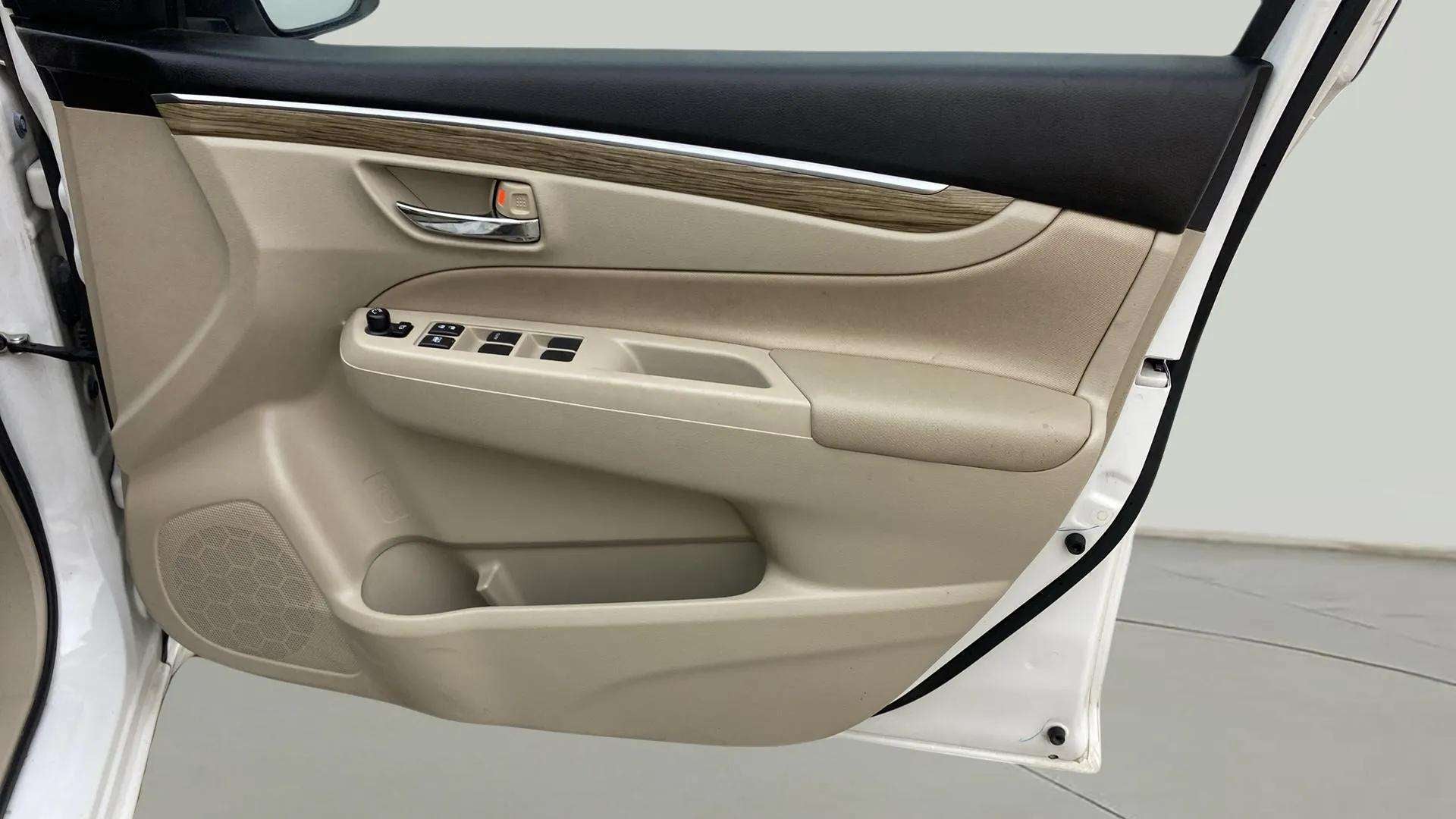 Interior front door panel of a Maruti Suzuki Ciaz