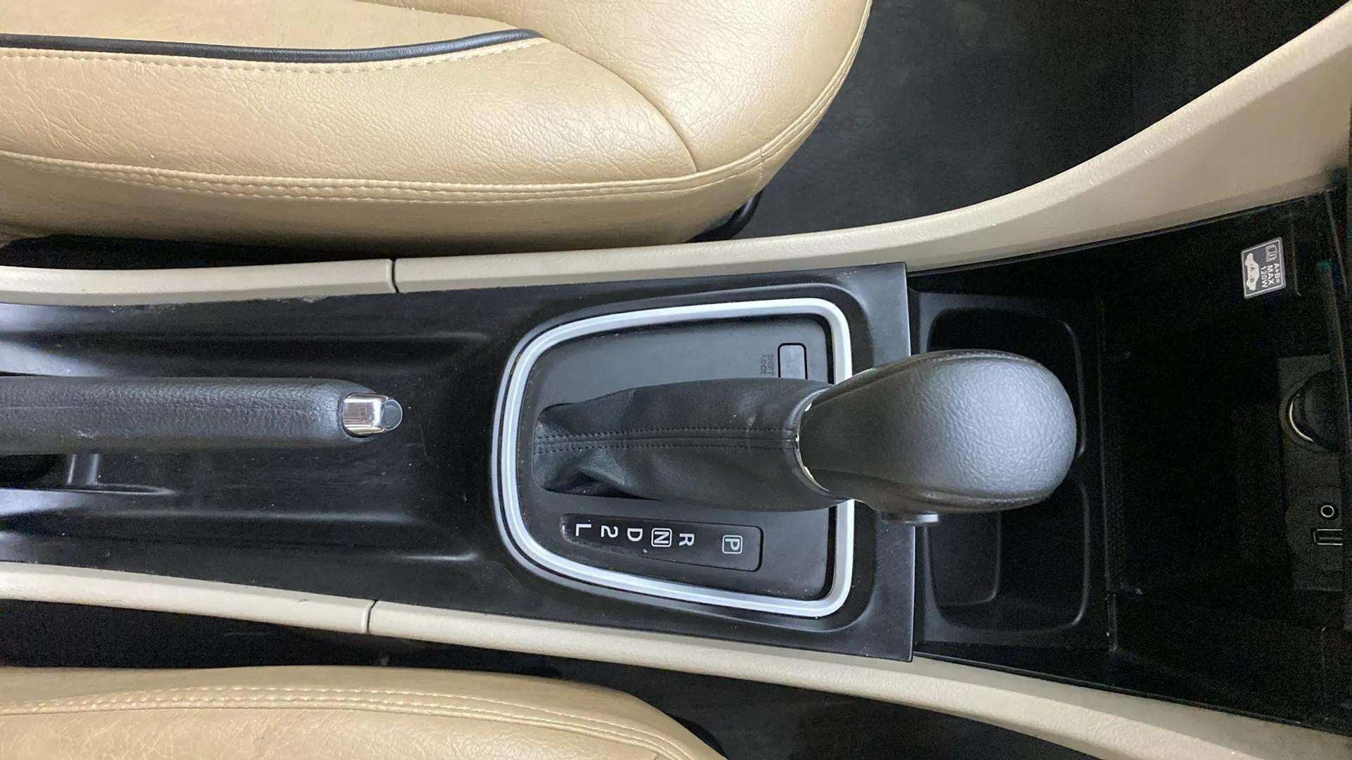 Center console and gear shifter of a Maruti Suzuki Ciaz