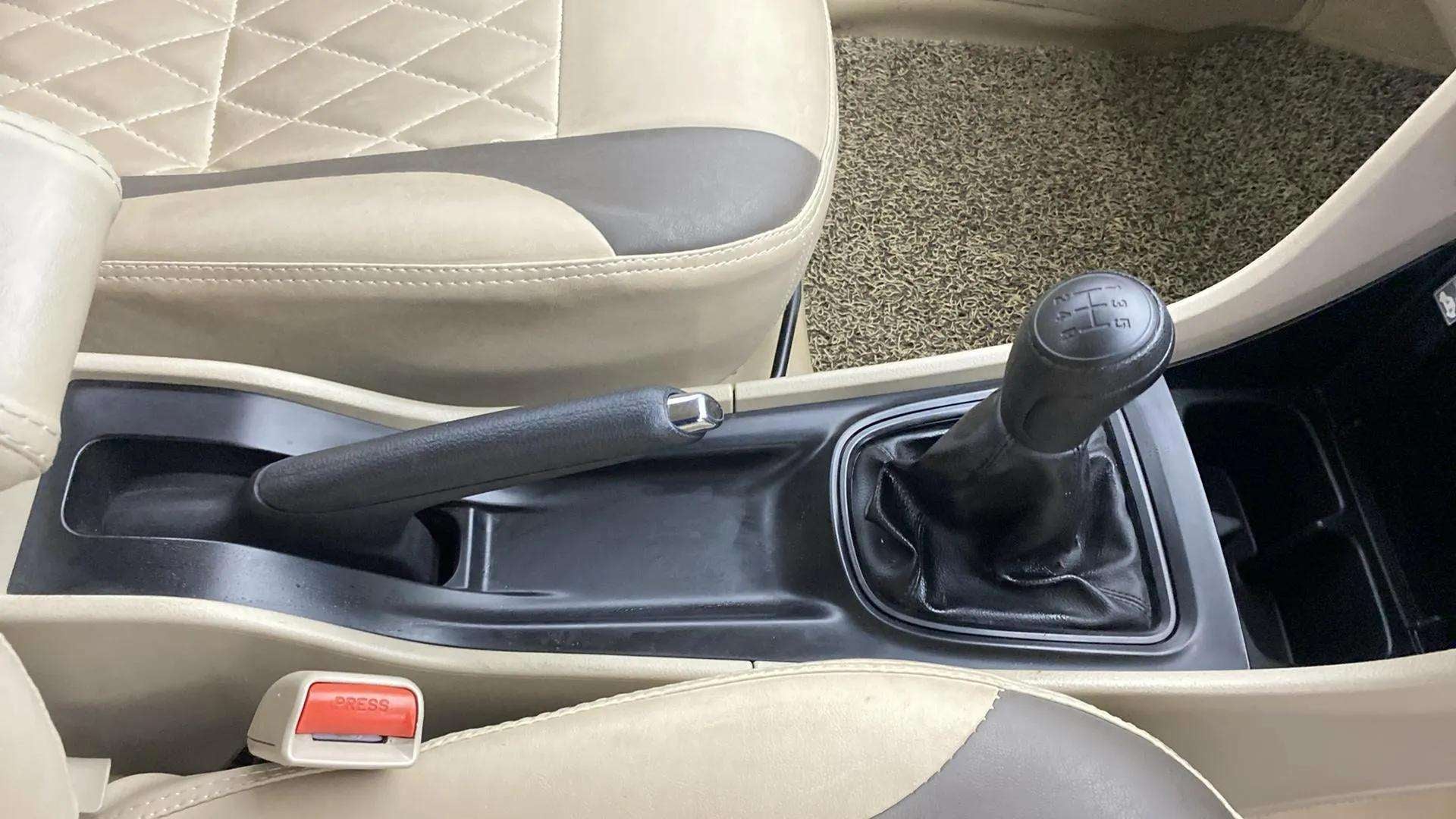 Center console with gear lever and handbrake of a Maruti Suzuki Ciaz
