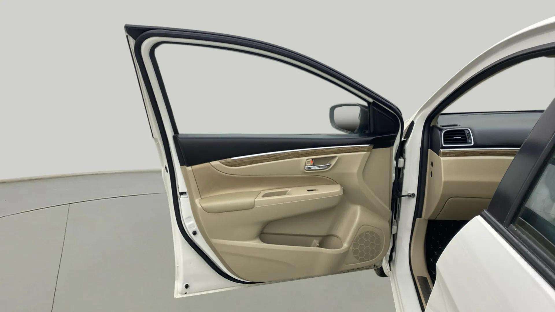 Front interior door panel of a Maruti Suzuki Ciaz