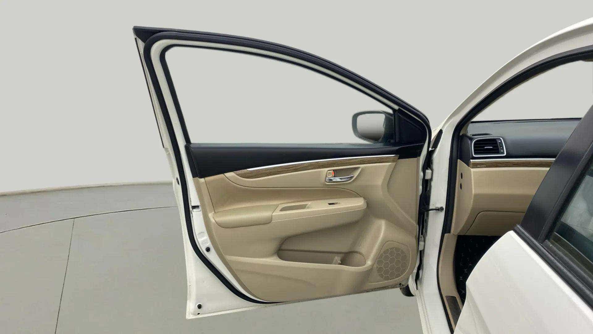 Front interior door panel of a Maruti Suzuki Ciaz