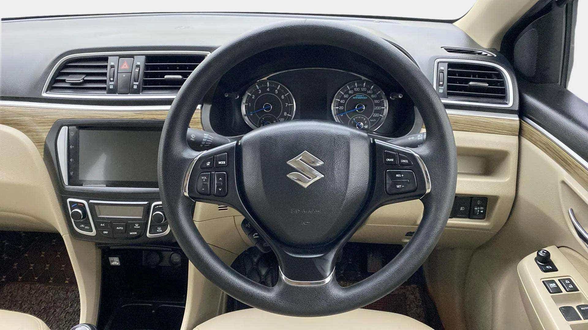 Interior dashboard and steering wheel of a Maruti Suzuki Ciaz