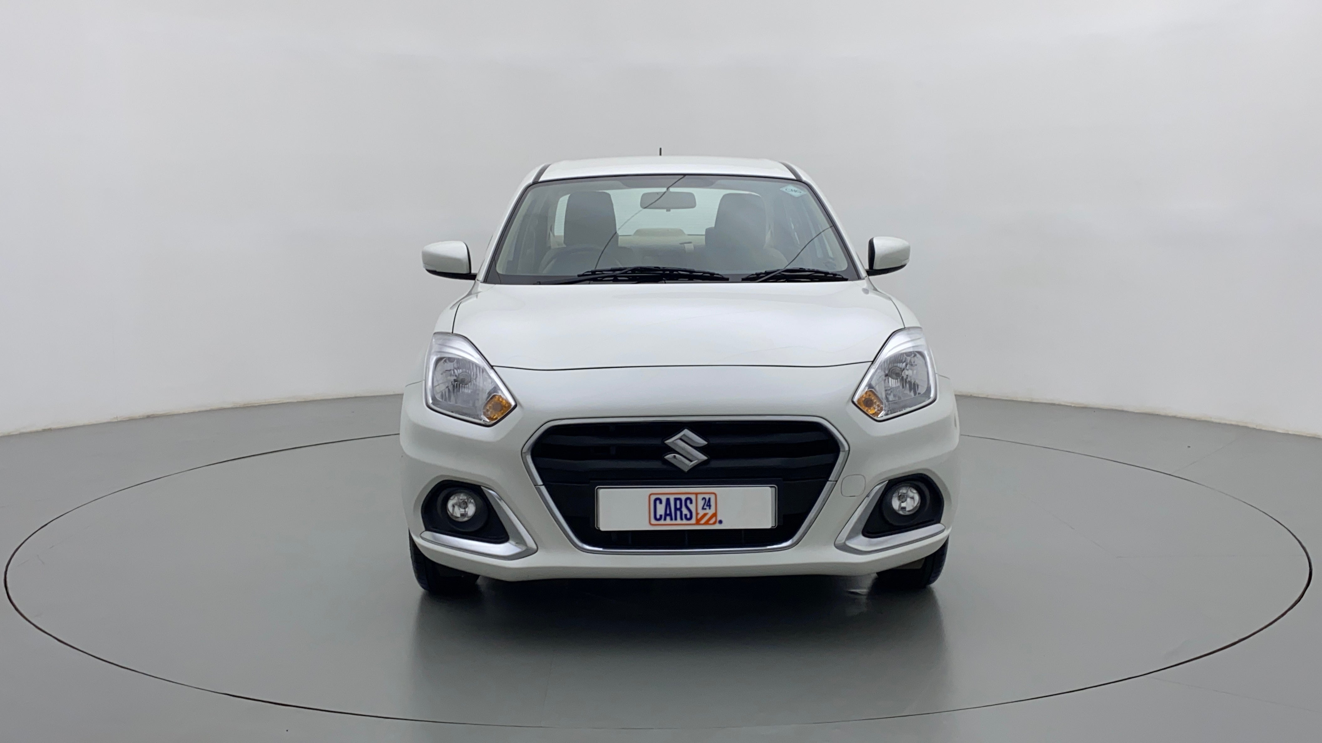 Front view of a arctic white Maruti Suzuki Dzire 2018-2023