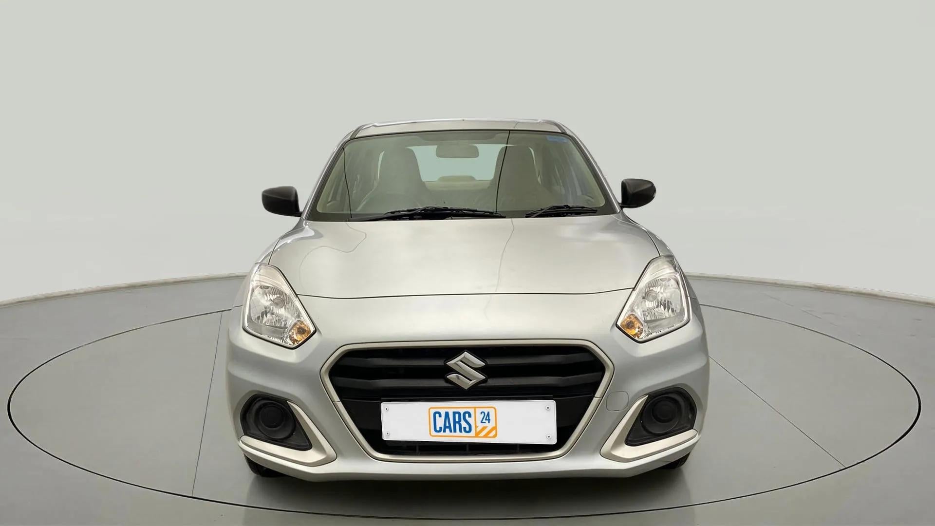Front view of a Splendid Silver Maruti Suzuki Dzire 2018-2023