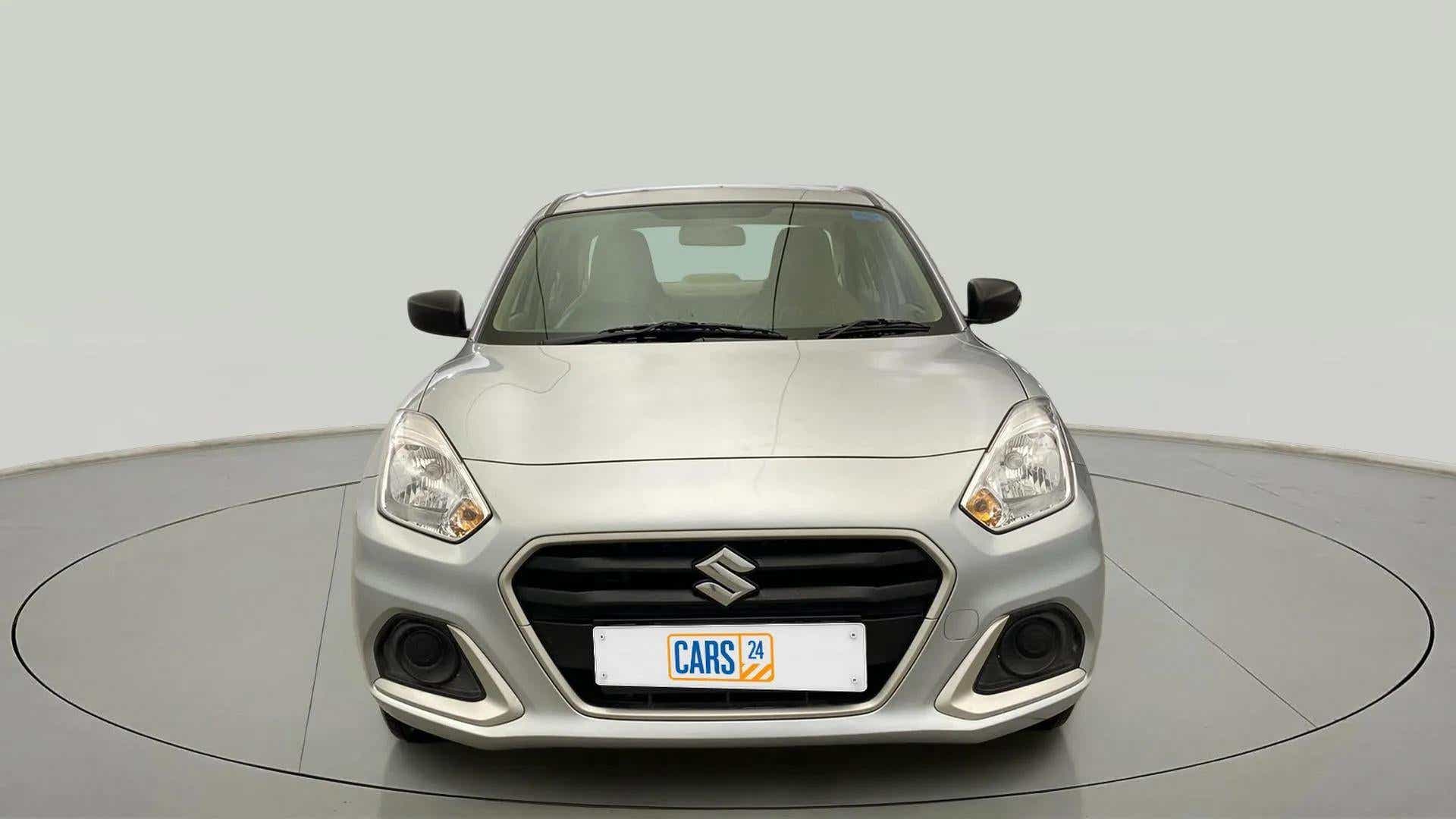 Front view of a Splendid Silver Maruti Suzuki Dzire 2018-2023