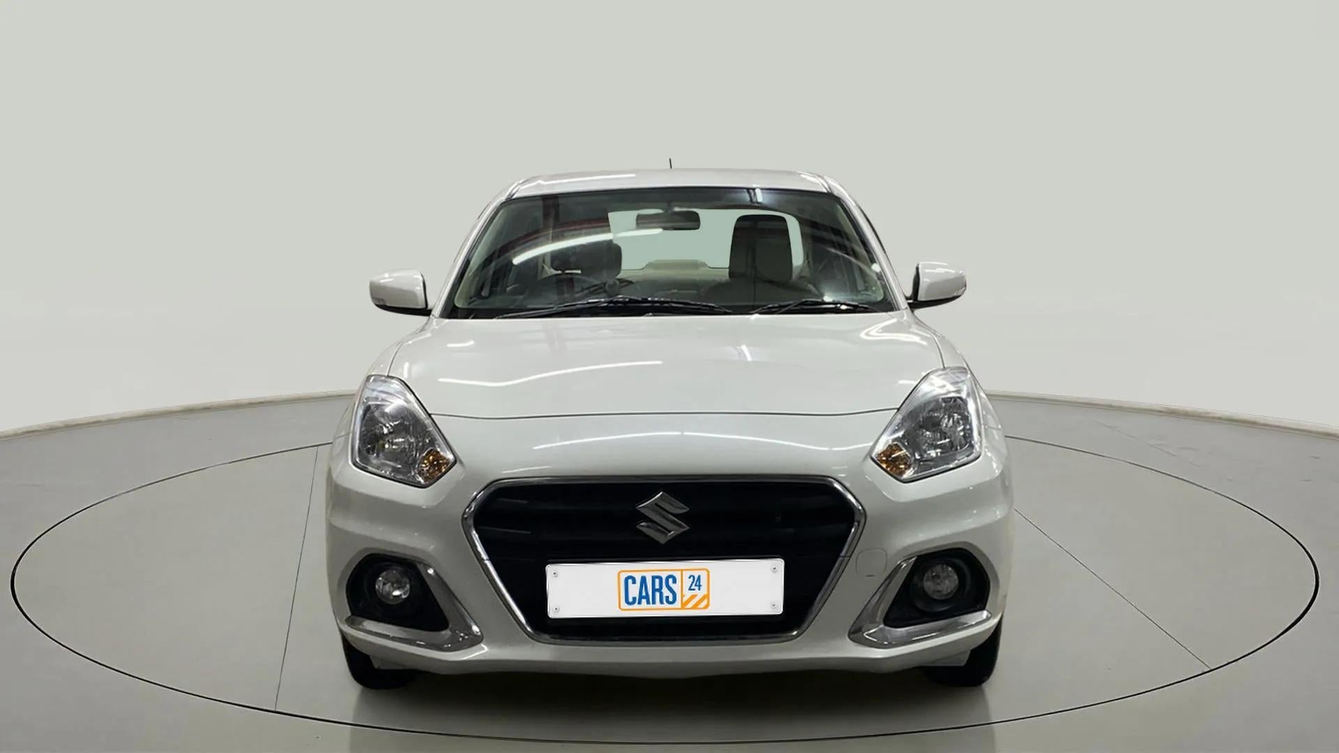 Front view of a arctic white Maruti Suzuki Dzire 2018-2023