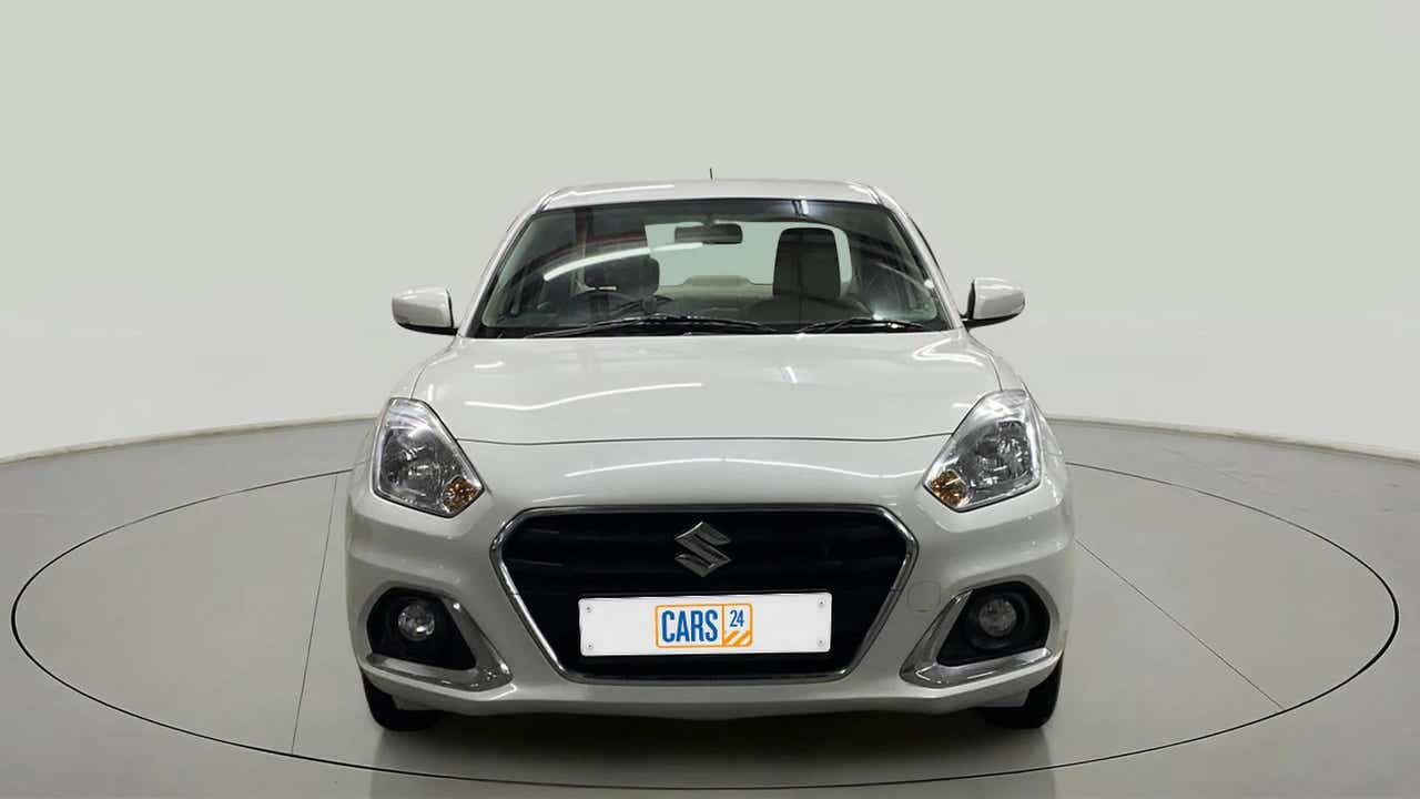 Front view of a arctic white Maruti Suzuki Dzire 2018-2023
