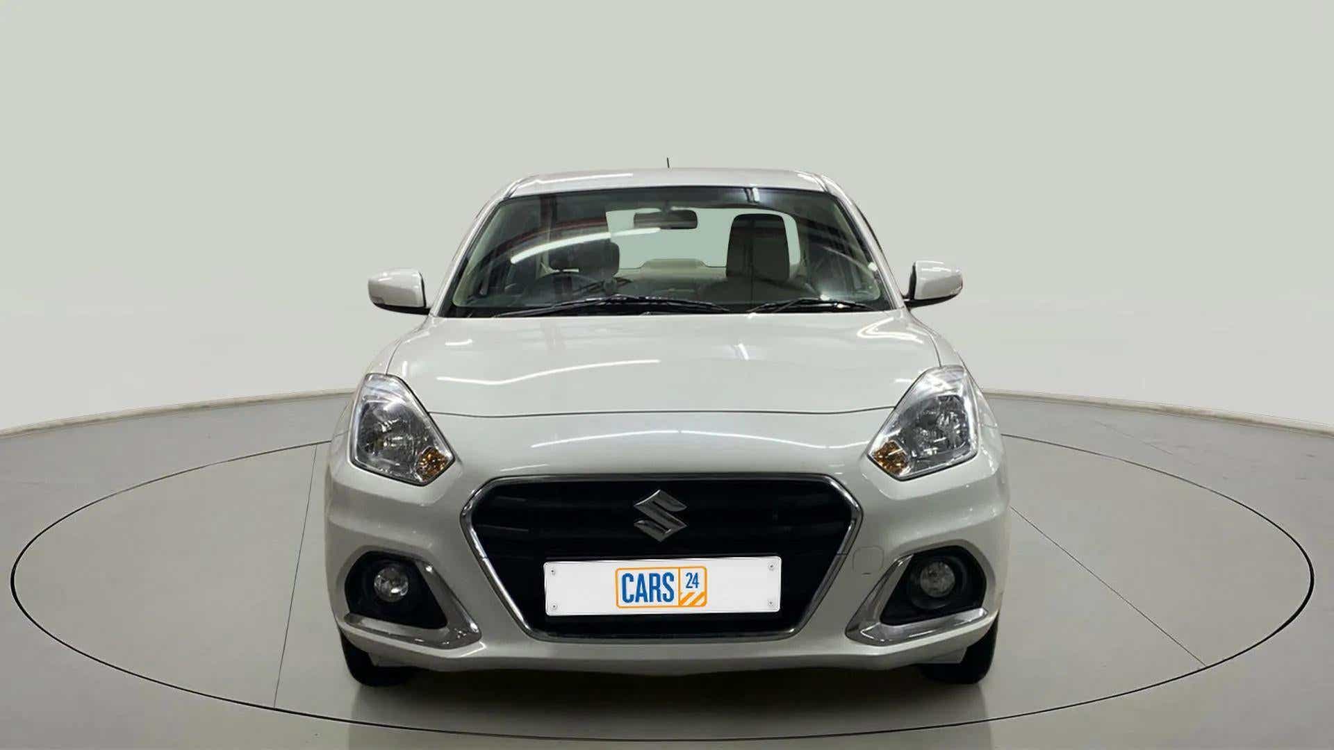 Front view of a arctic white Maruti Suzuki Dzire 2018-2023