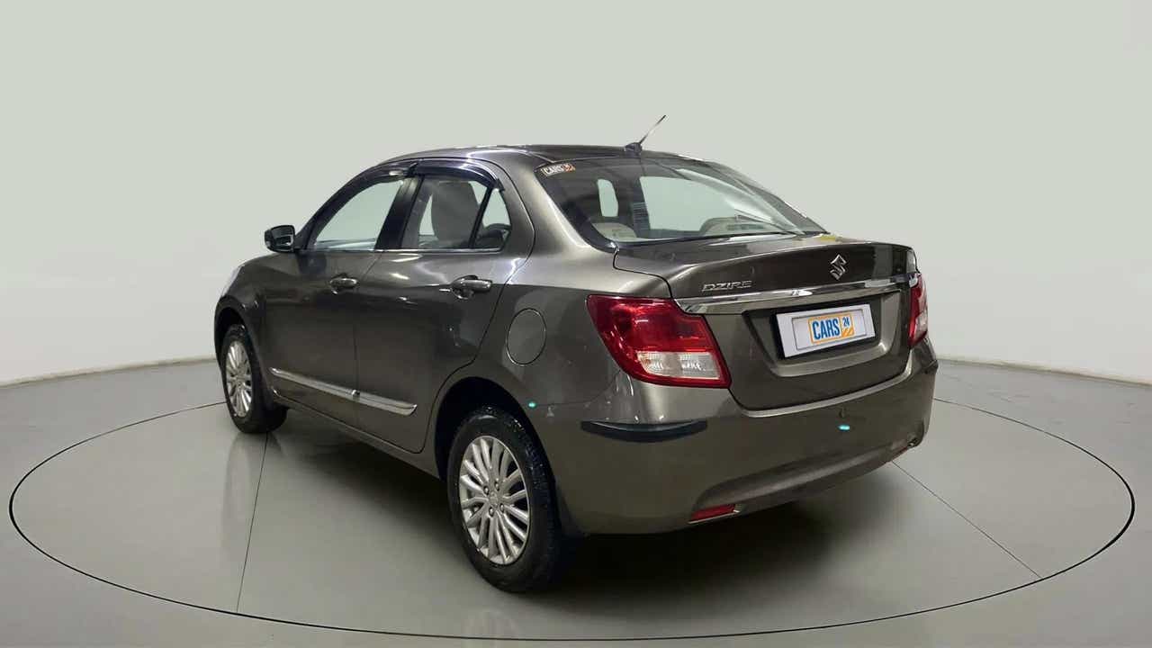 Rear three-quarter of a Maruti Suzuki Dzire 2018-2023