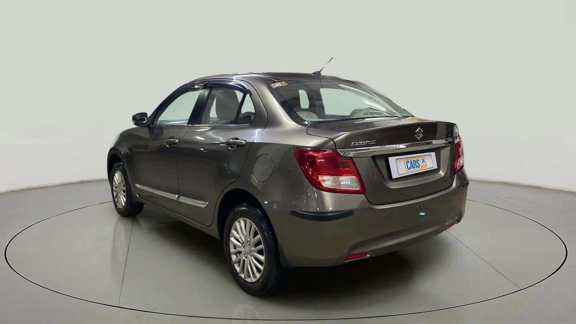 Rear three-quarter of a Maruti Suzuki Dzire 2018-2023