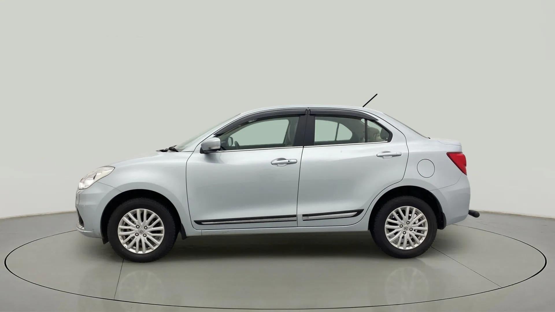 Side view of a splendid silver Maruti Suzuki Dzire