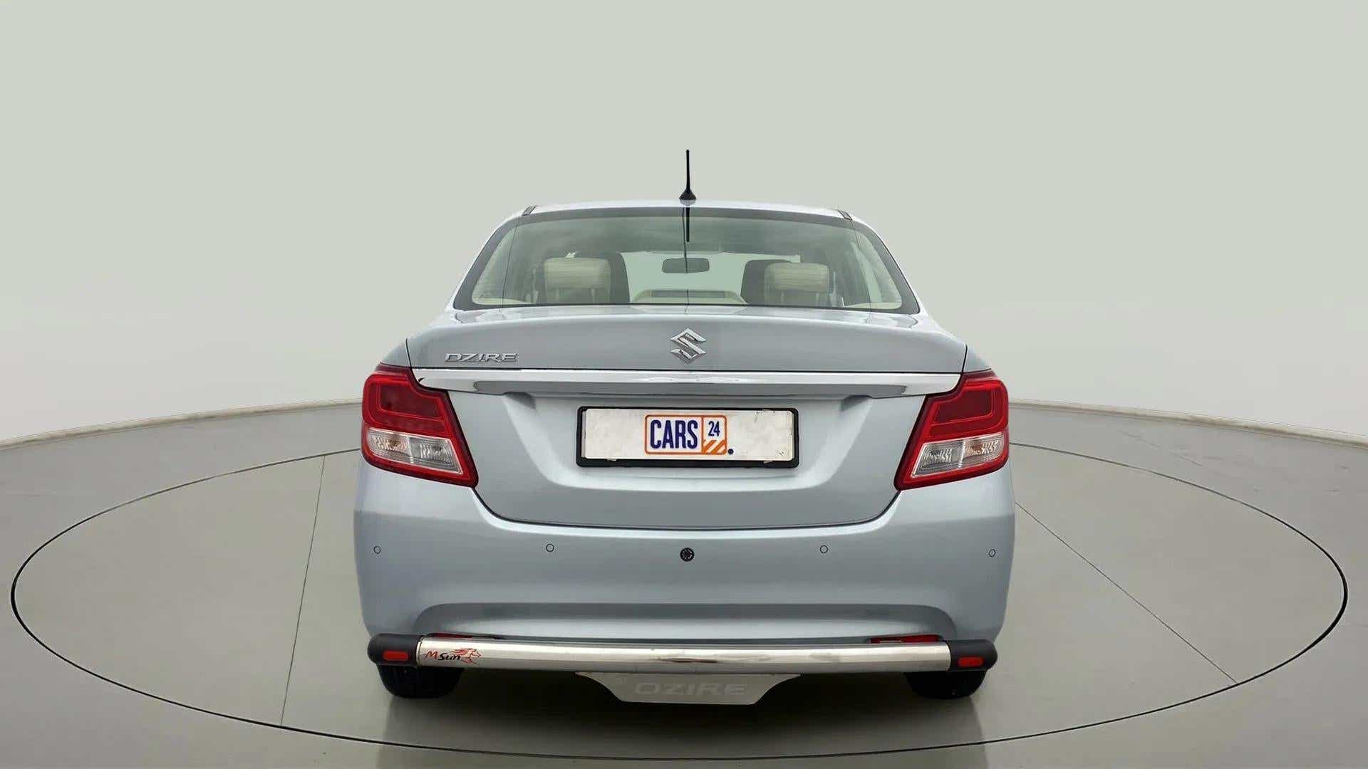 Rear view of a splendid silver Maruti Suzuki Dzire