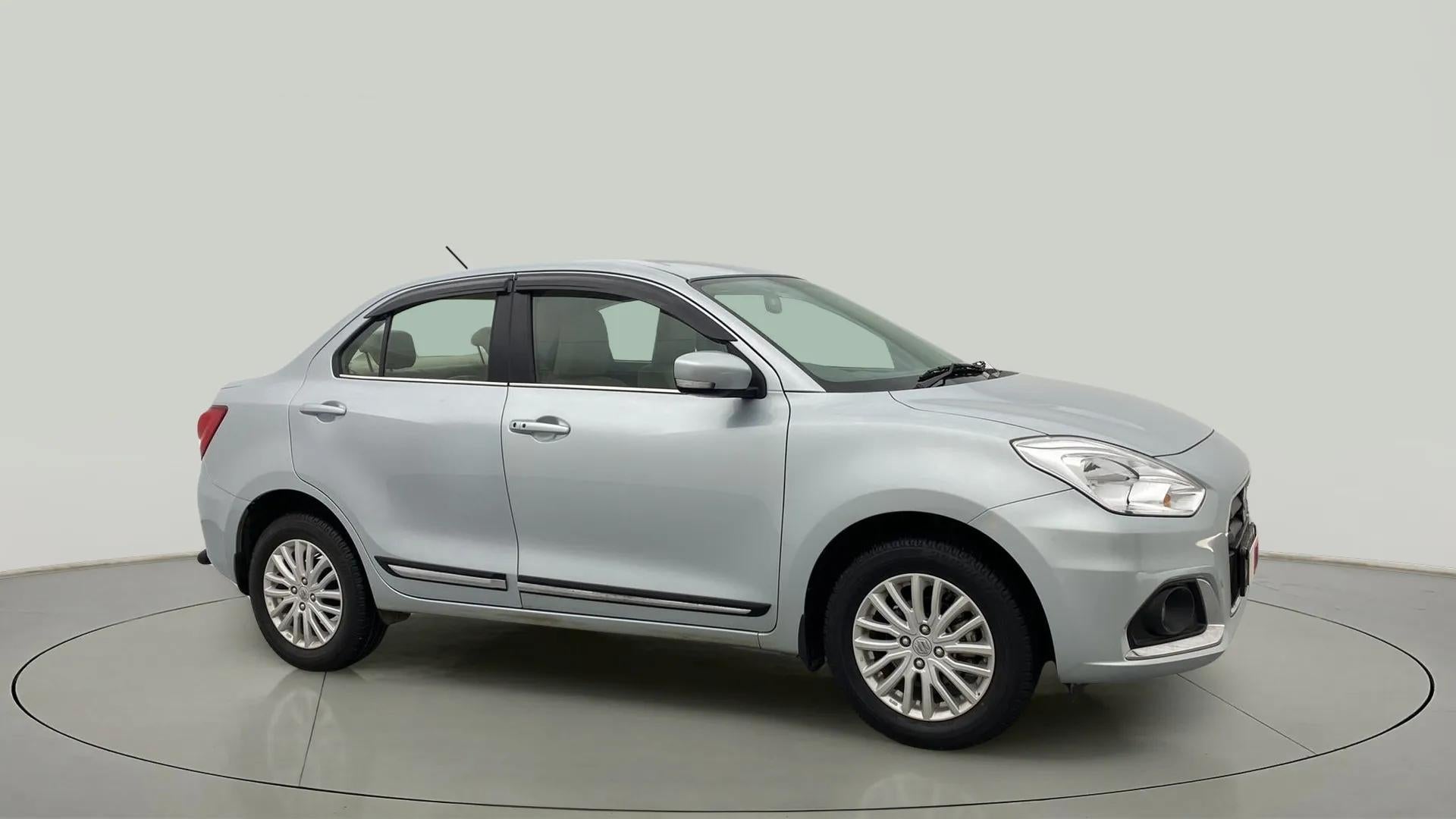 Side view of a splendid silver Maruti Suzuki Dzire