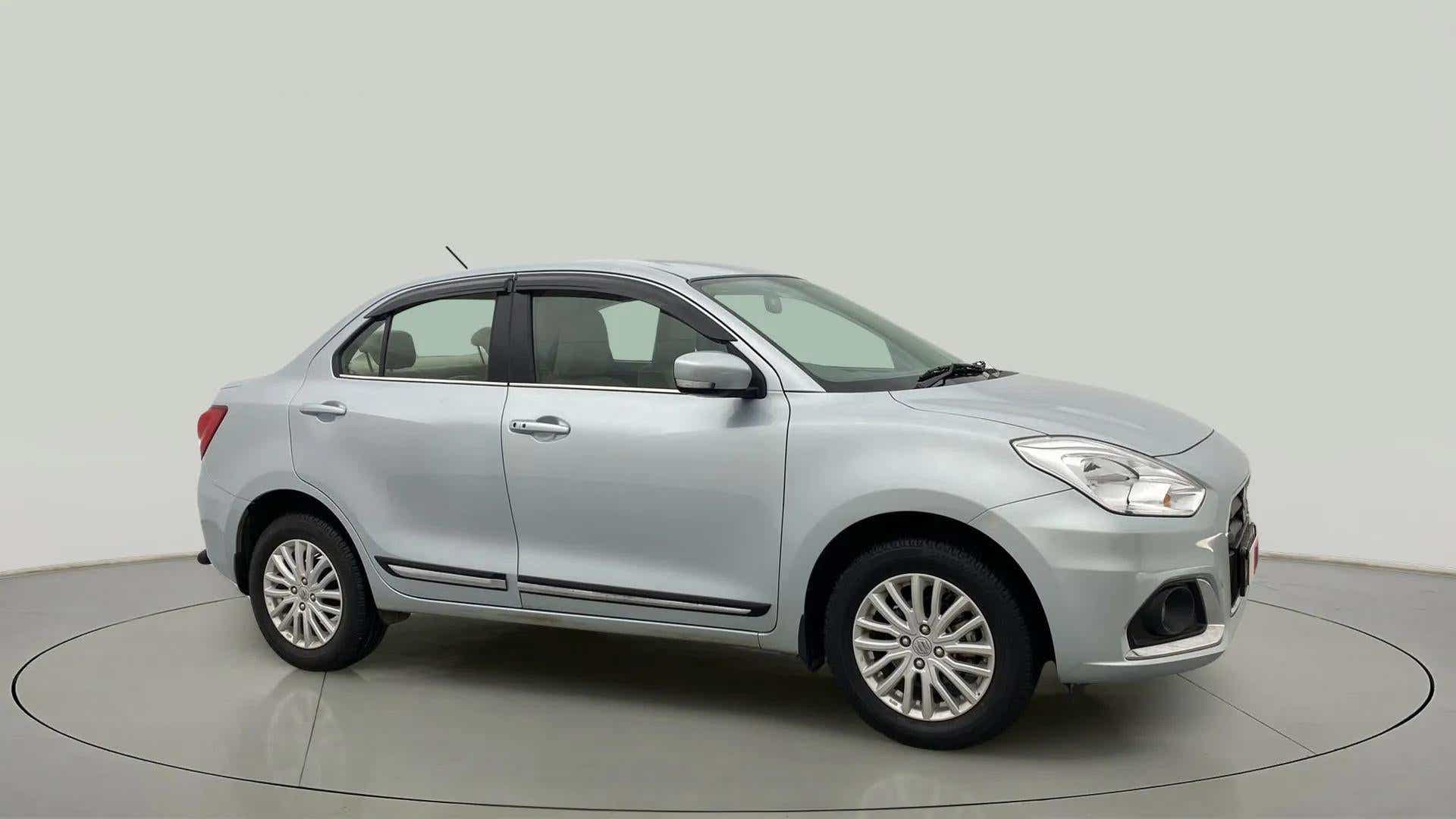 Side view of a splendid silver Maruti Suzuki Dzire