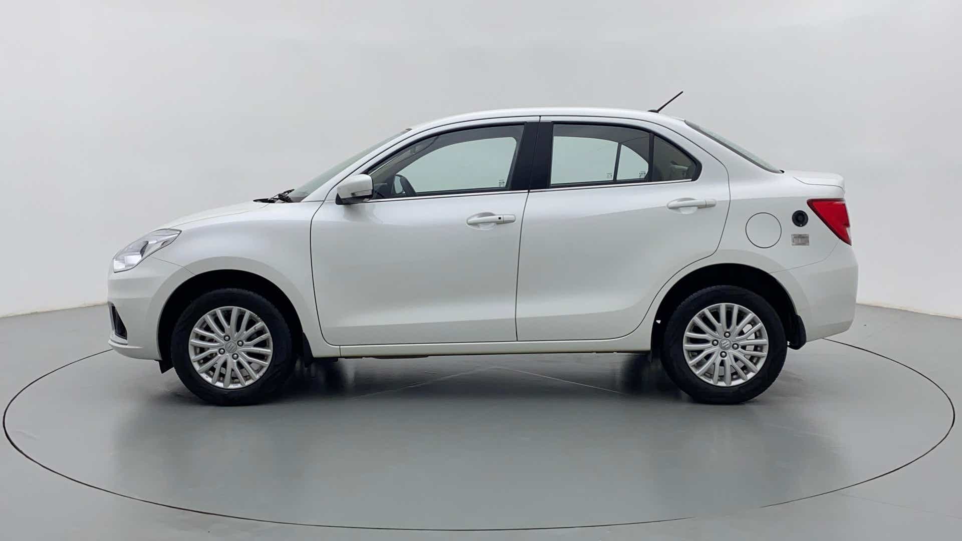 Side view of a arctic white Maruti Suzuki Dzire 2018-2023
