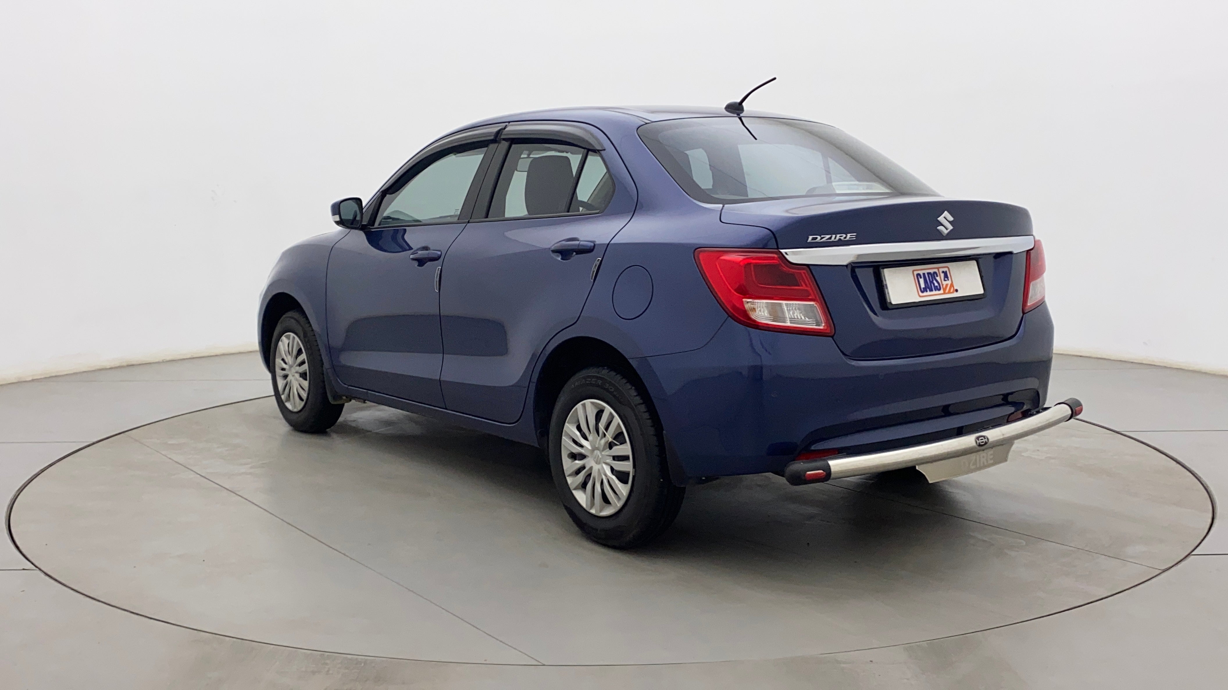 Rear three-quarter view of a Maruti Suzuki Dzire 2018-2023