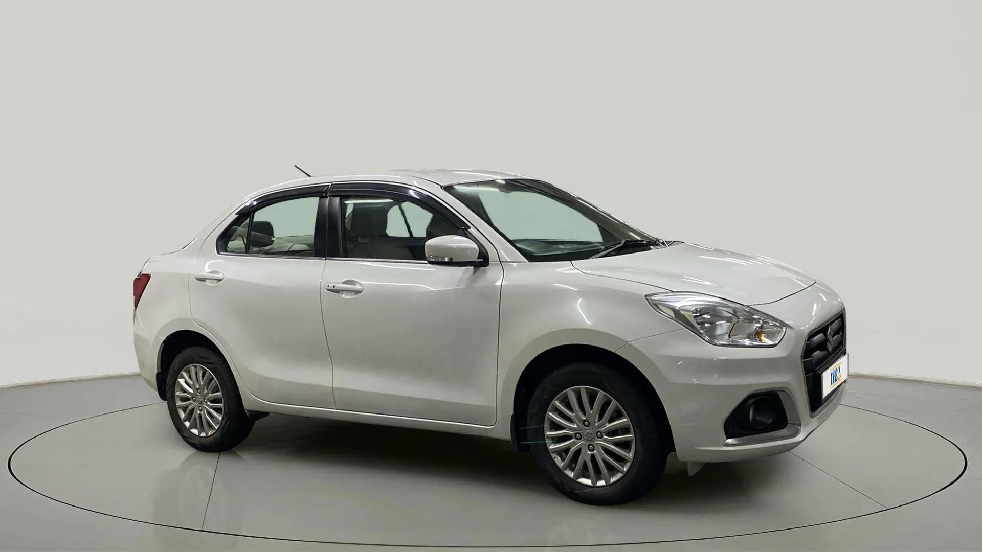 Side view of a Arctic White Maruti Suzuki Dzire 2018-2023