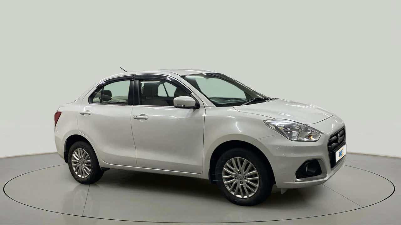 Side view of a Arctic White Maruti Suzuki Dzire 2018-2023