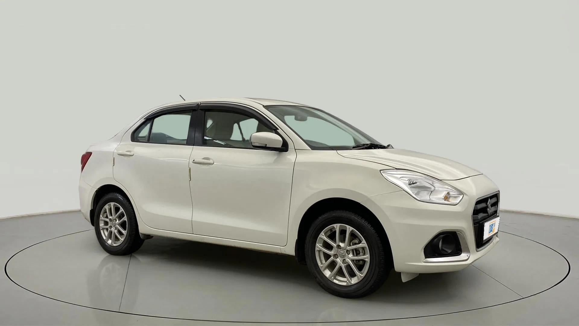 Front three-quarter view of a Pearl Arctic White Maruti Suzuki Dzire