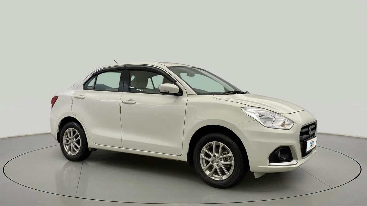 Front three-quarter view of a Pearl Arctic White Maruti Suzuki Dzire