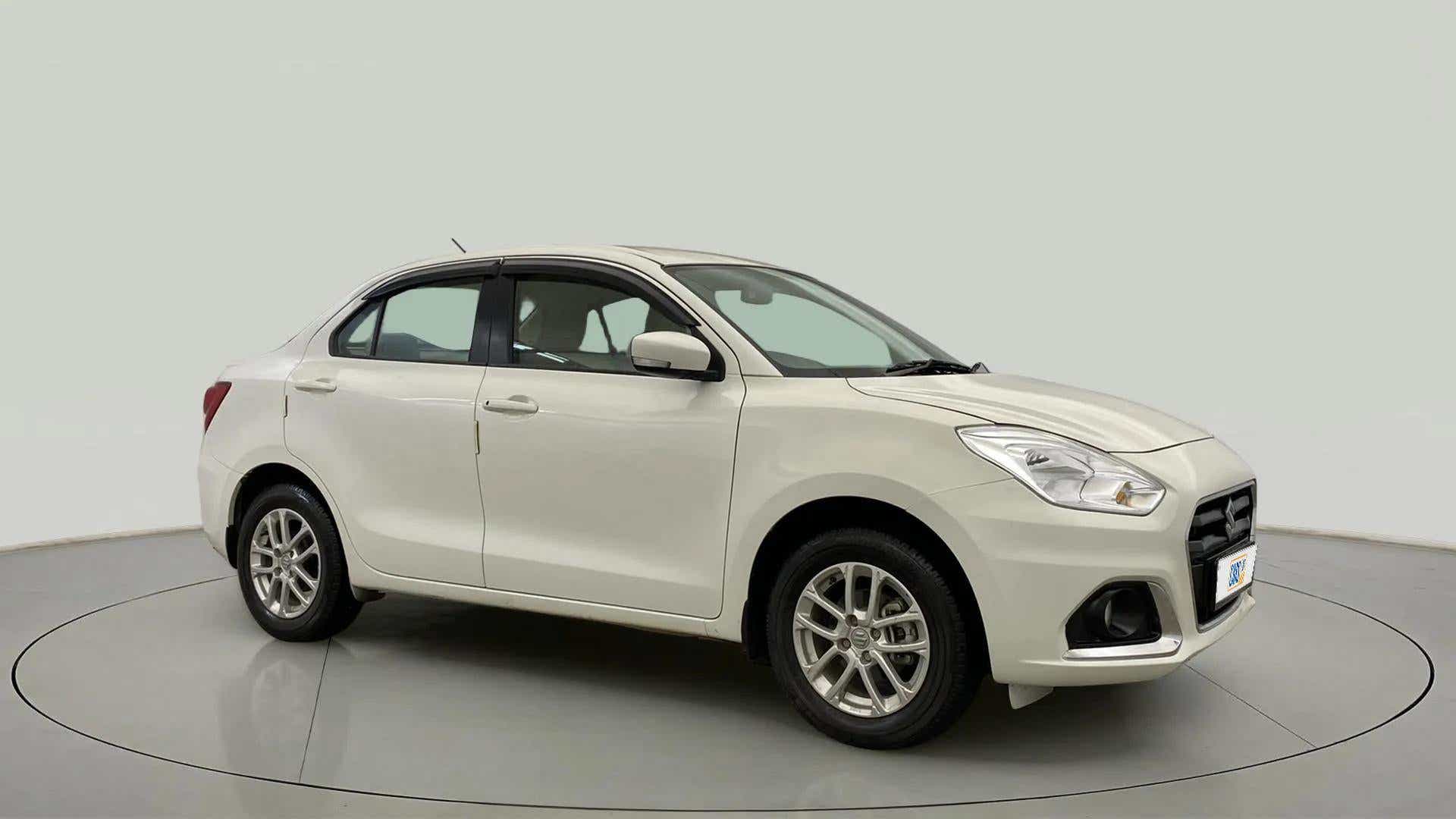 Front three-quarter view of a Pearl Arctic White Maruti Suzuki Dzire
