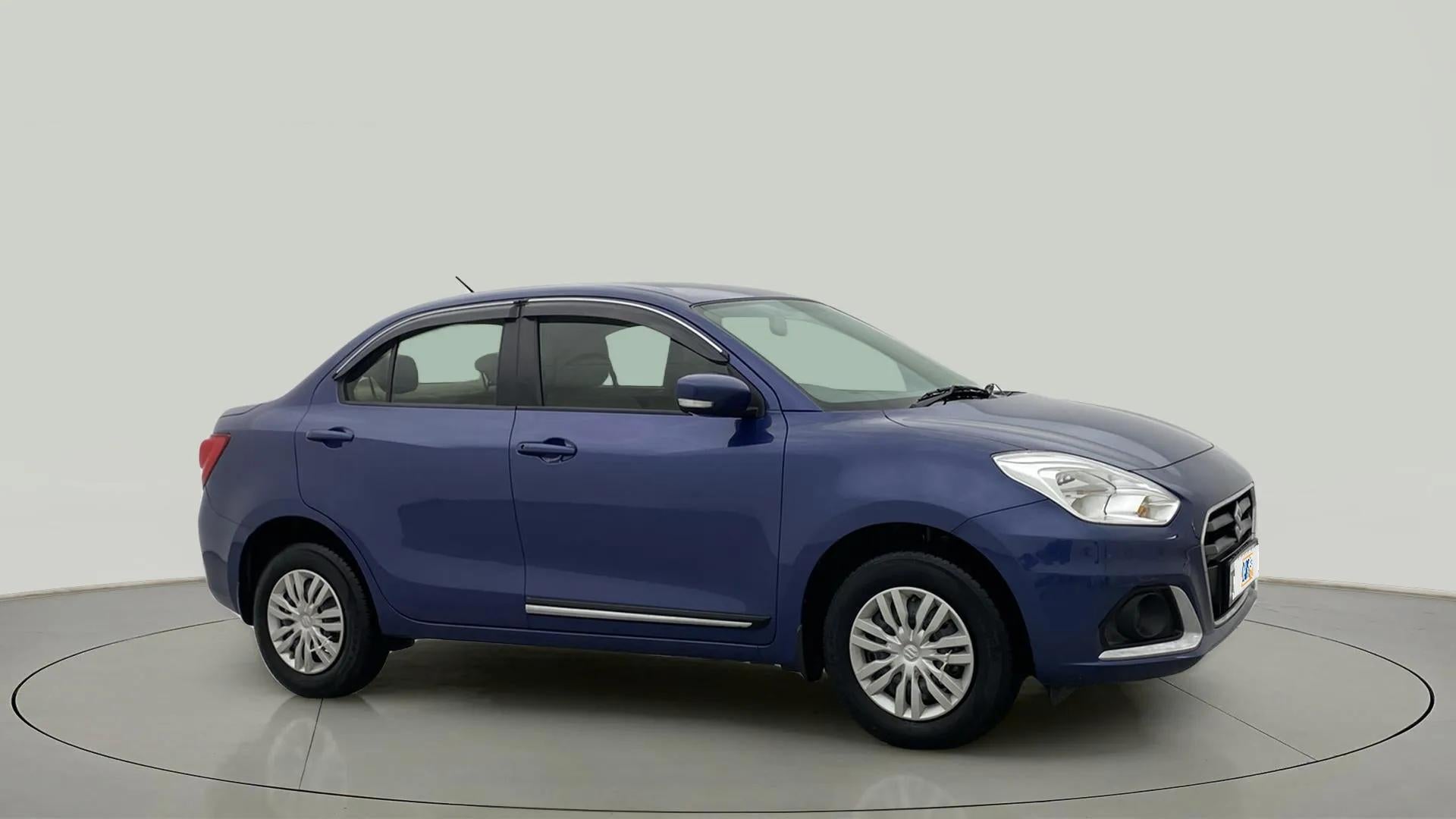 Side view of a oxford blue Maruti Suzuki Dzire 2018-2023