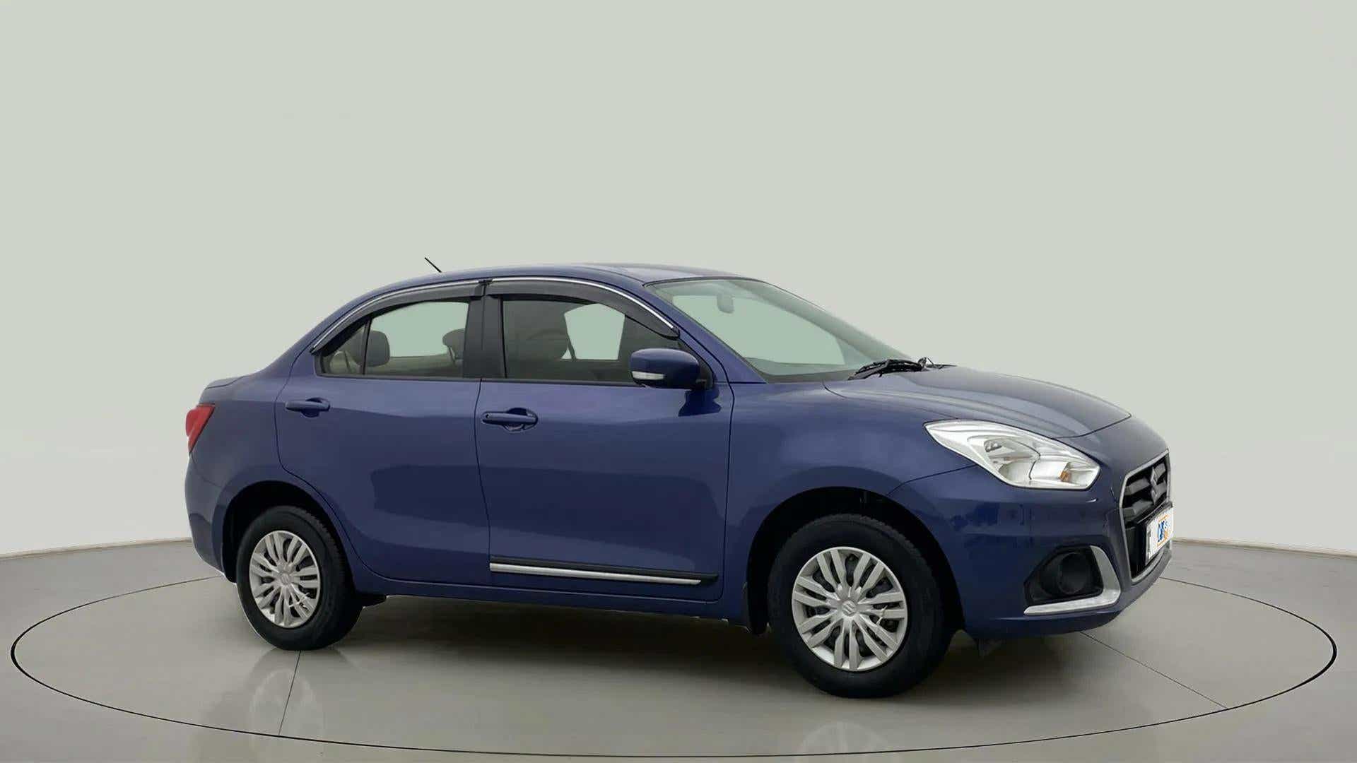 Side view of a oxford blue Maruti Suzuki Dzire 2018-2023