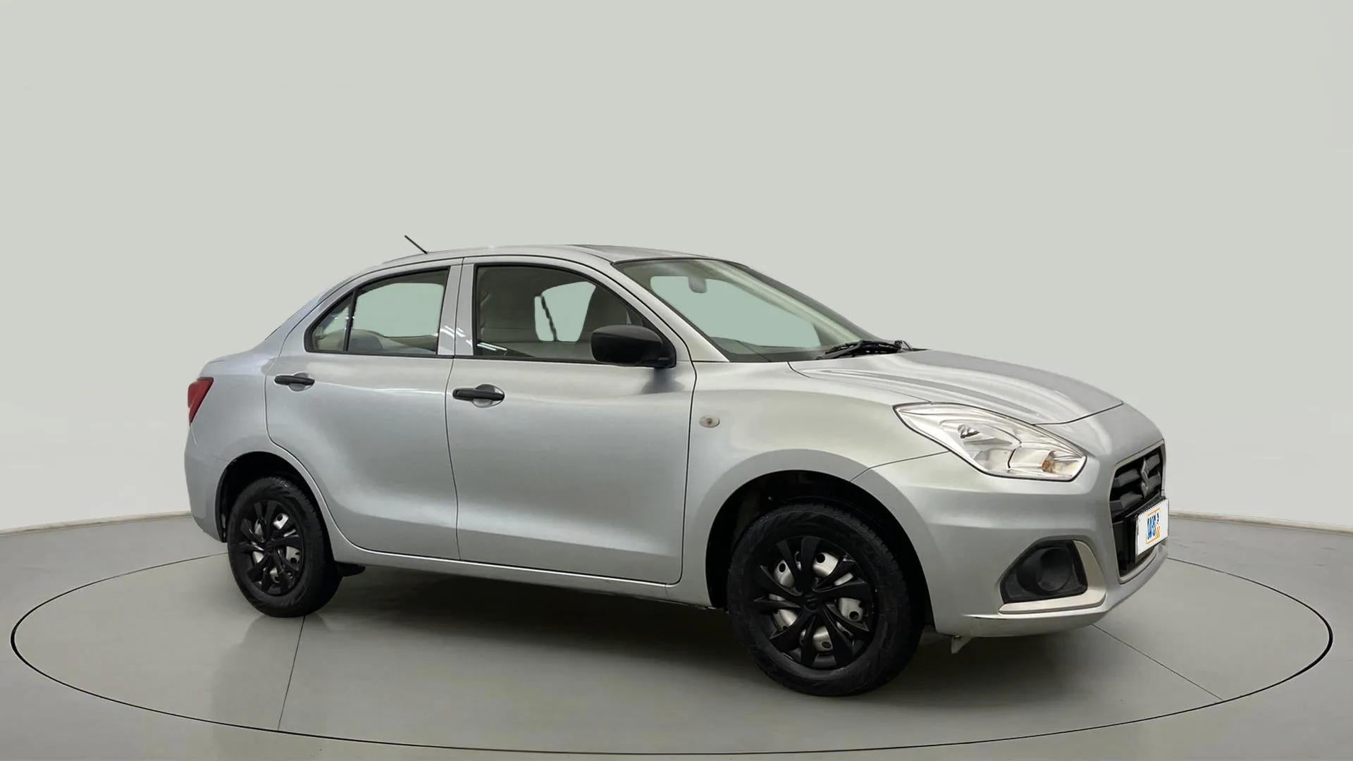 Side view of a splendid silver Maruti Suzuki Dzire 2018-2023