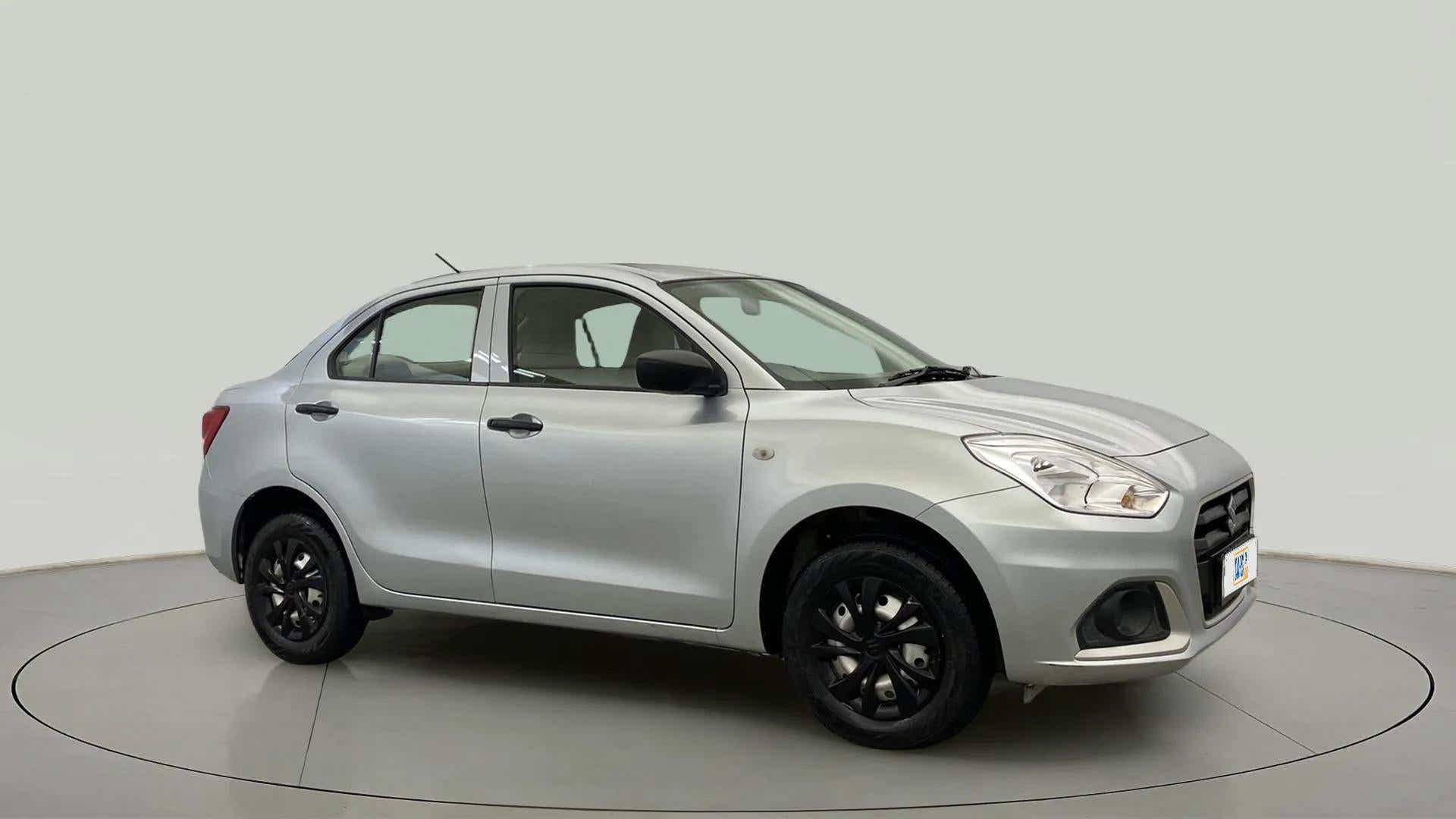 Side view of a splendid silver Maruti Suzuki Dzire 2018-2023