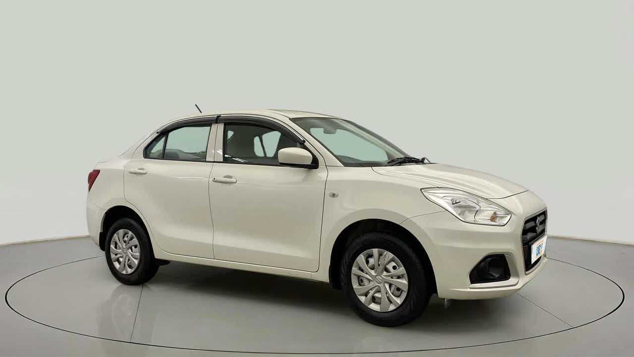 Front and side view of a pearl arctic white Maruti Suzuki Dzire