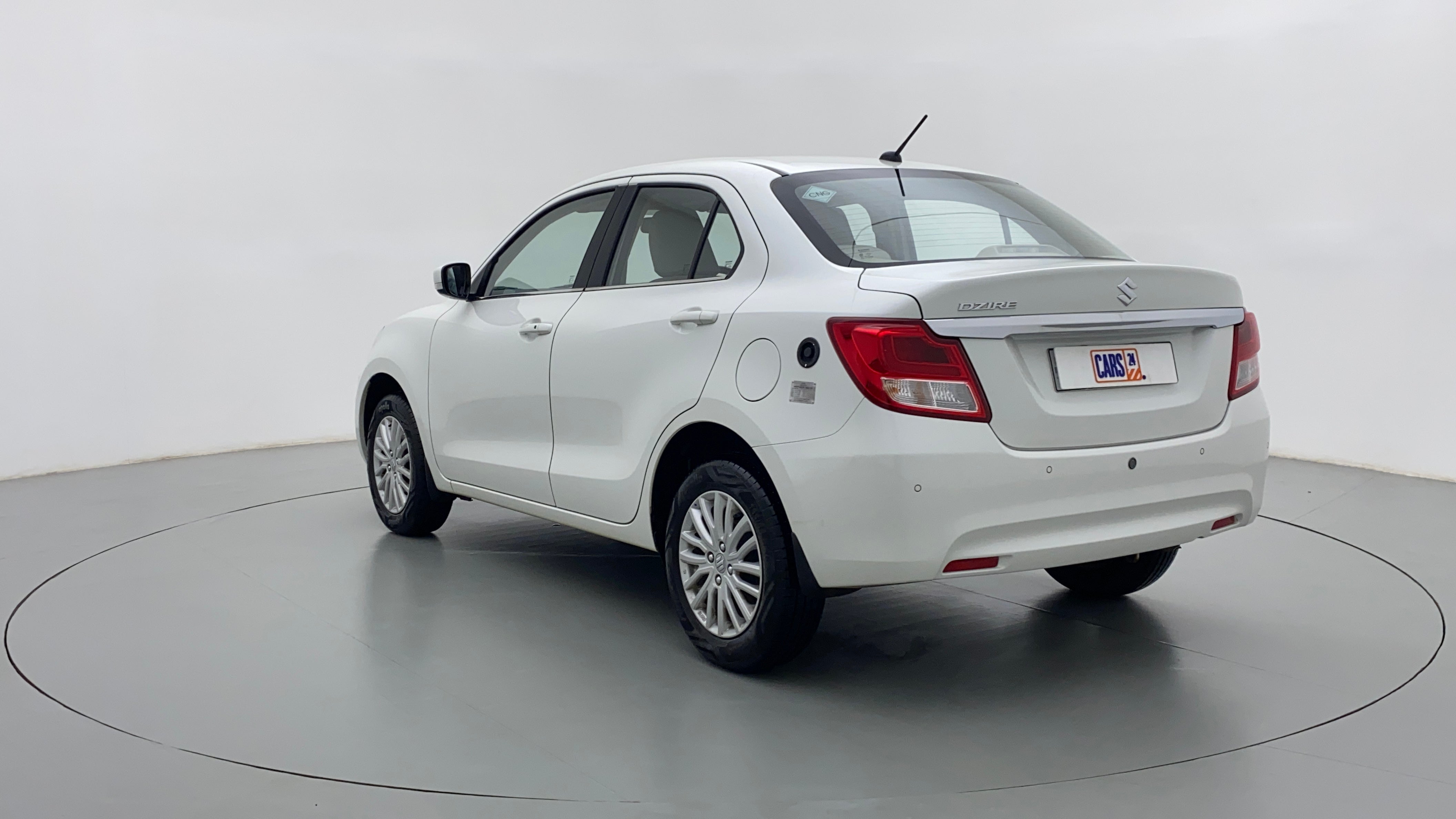 Rear three-quarter view of a Arctic White Maruti Suzuki Dzire 2018-2023