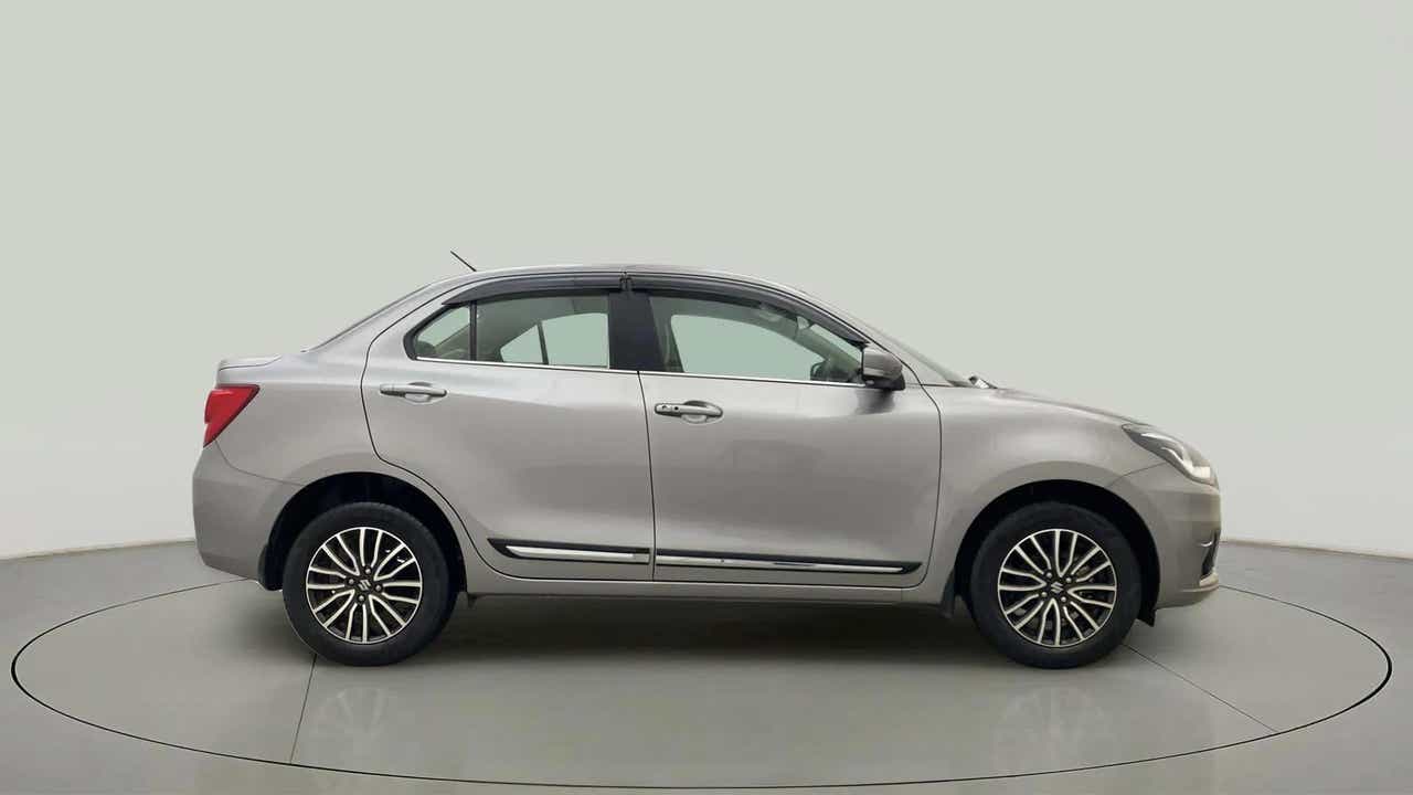 Side view of a splendid silver Maruti Suzuki Dzire 2018-2023